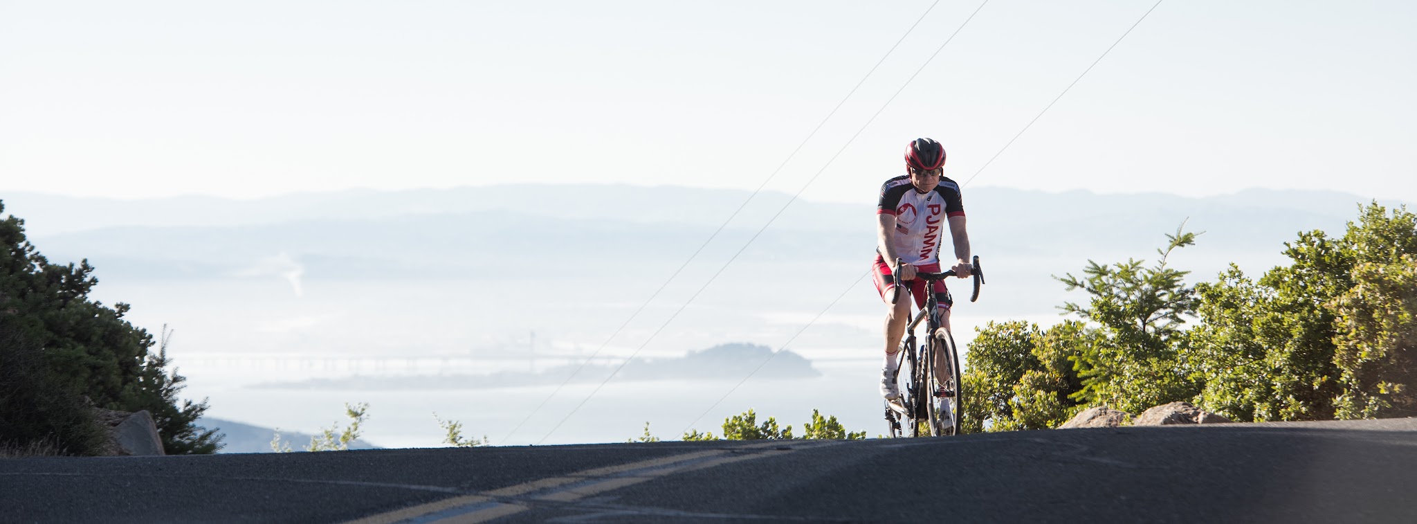 Mt. Tamalpais from Fairfax Bolinas Road Cycling Mt. Tamalpais from Fairfax Bolinas Road - Cyclist at West Peak with SF in background