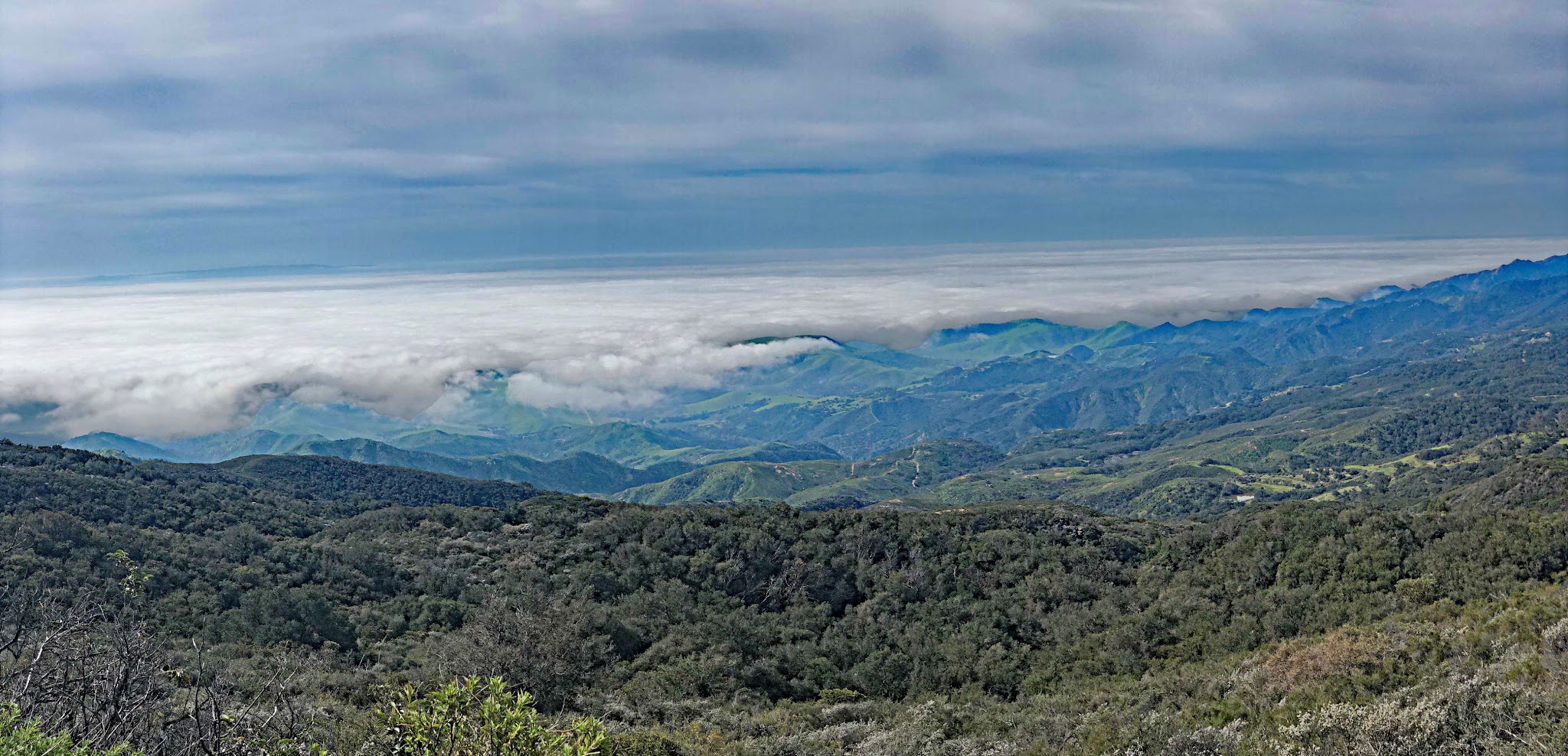 Cycling Refugio Road - aerial drone photo of clouds and hillside