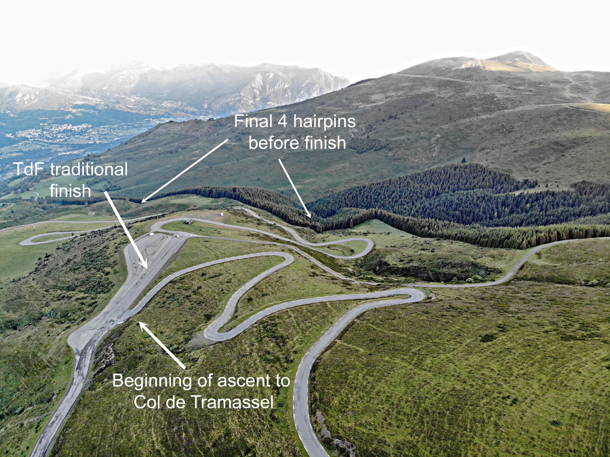Cycling Hautacam aerial drone view of the beginning of the ascent to Col de Tramassel, the traditional Tour de France finish, and the final 4 hairpins before the finish