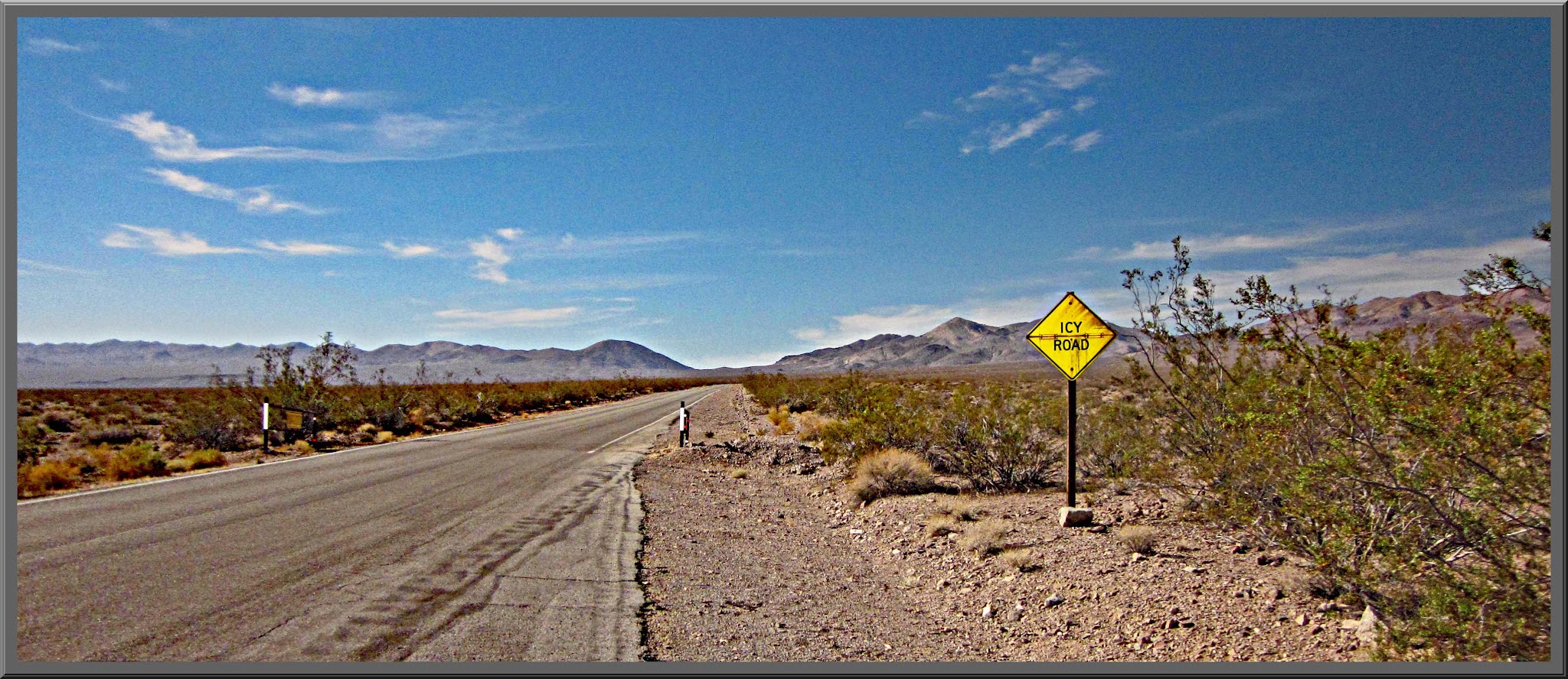 California's most scenic bike climbs Biking up Dantes View Death Valley - Icy Road sign in death valley
