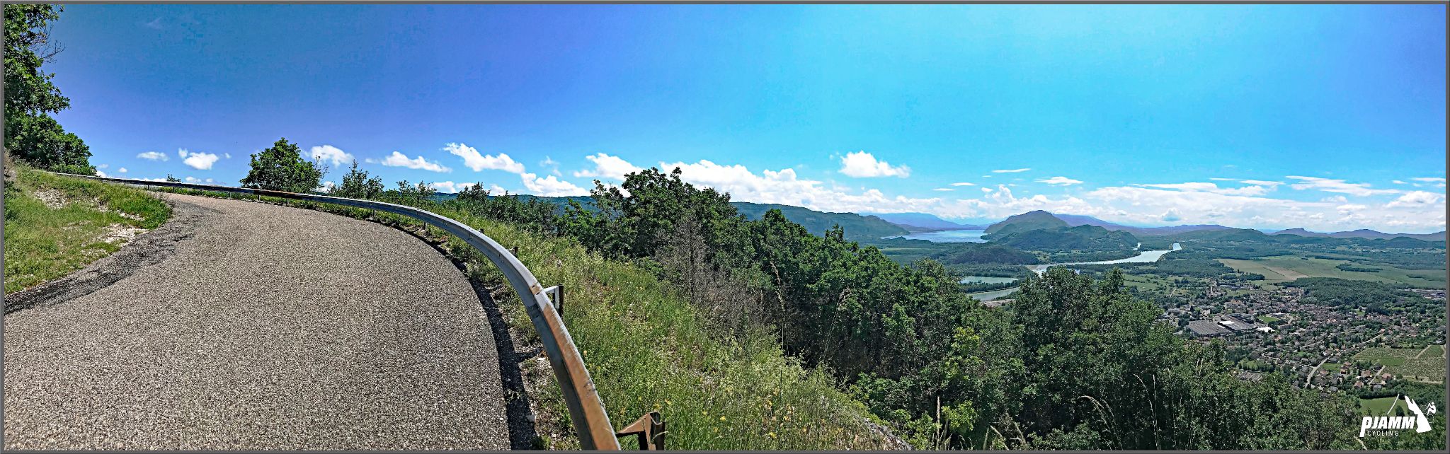 photo shows curved one-lane mountain roadway