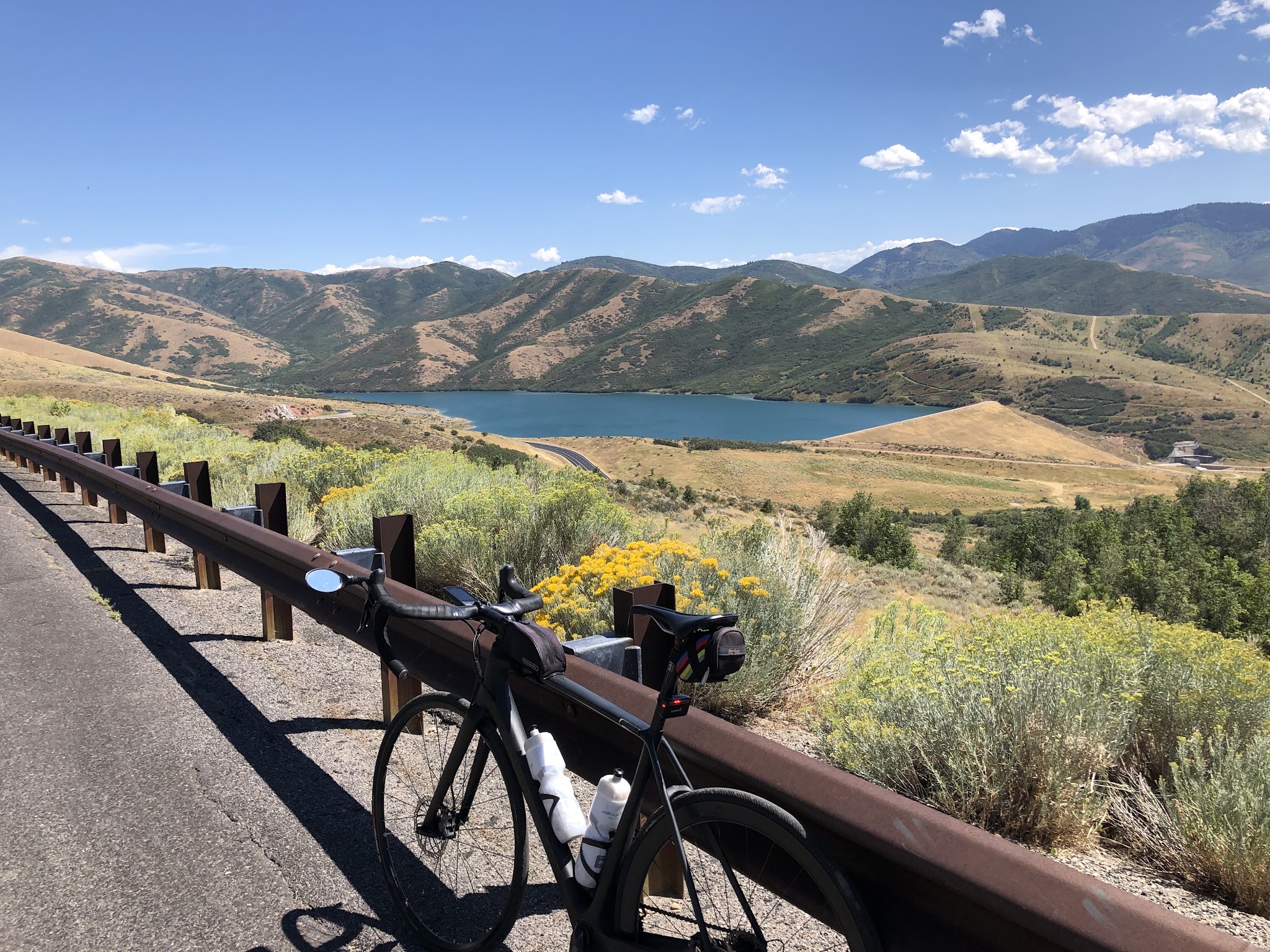 Bike climb Big Mountain Summit West - bike leaning against guardrail with little dell reservoir in background