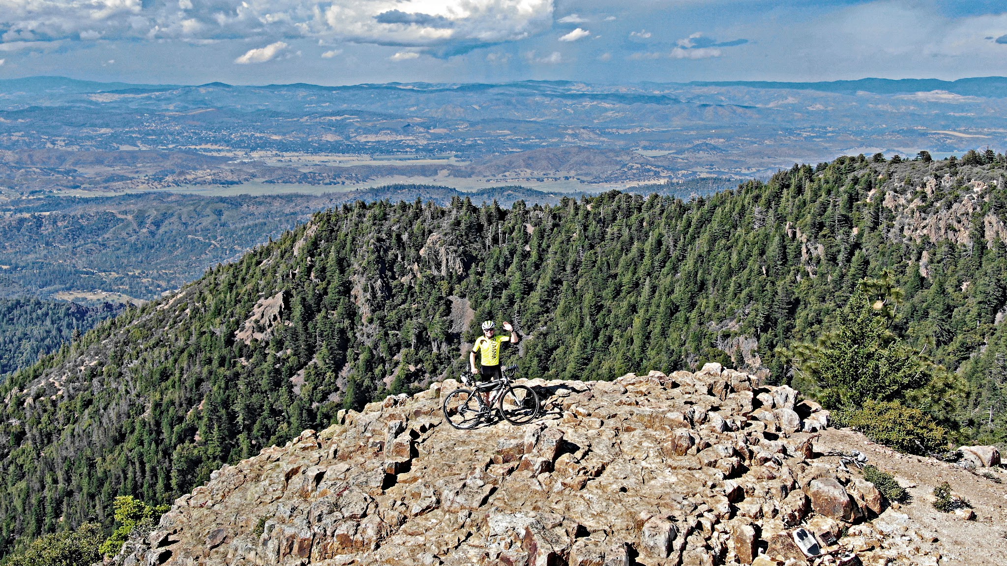 Cycling Mt. St. Helena - cyclist on the summit waiving with bike - DJI Mavic 2 Zoom aerial drone photo