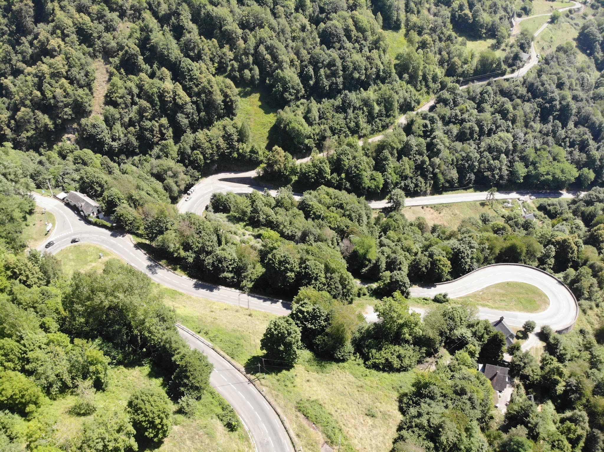 Climbing Col de Peyresourde from Bagneres-de-Luchon by bike - aerial drone photo of hairpin and switchbacks