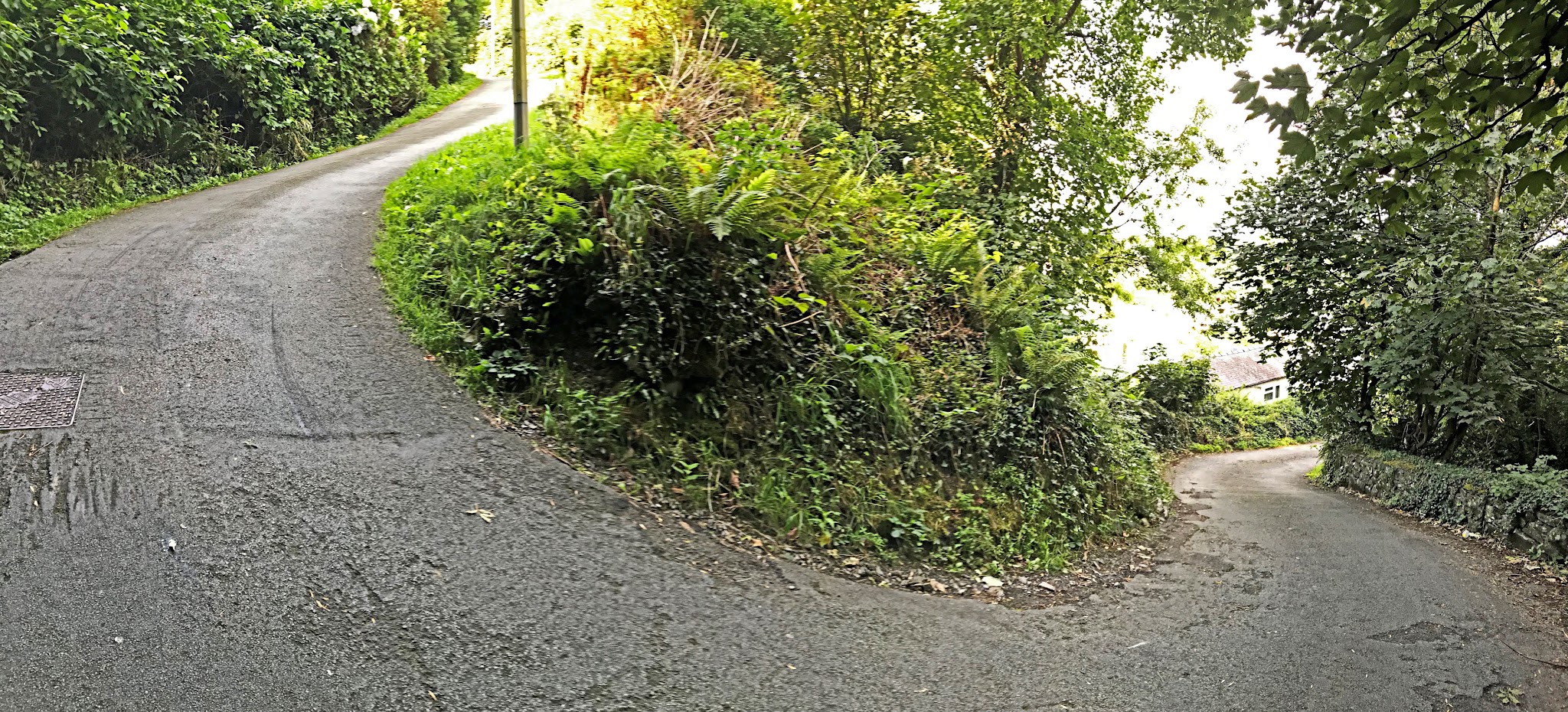 Cycling Ffordd Pen Llech, Wales - view of a sharp corner along 25% grade segment of one-lane roadway