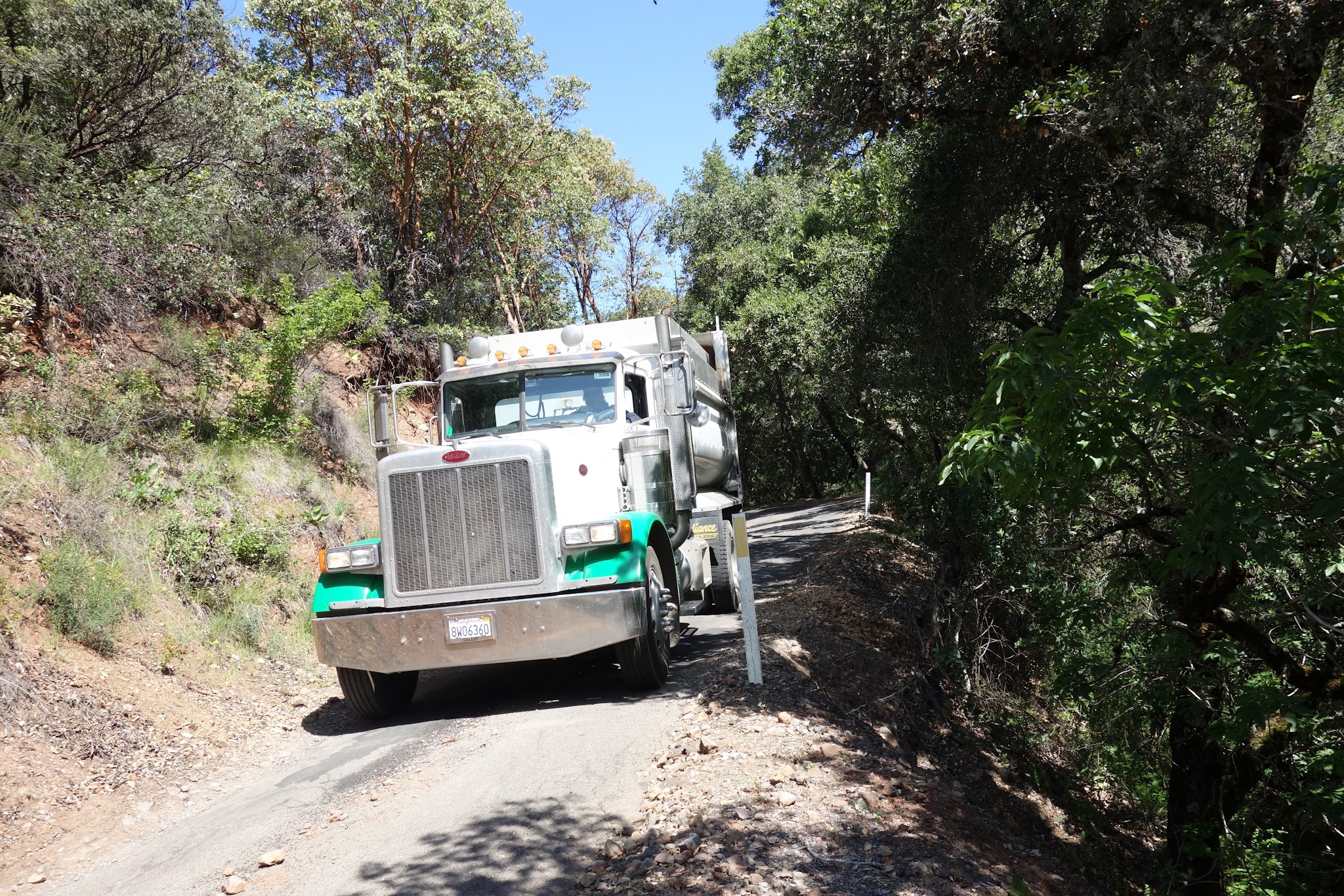Climbing Cavedale Road by bike - truck on road