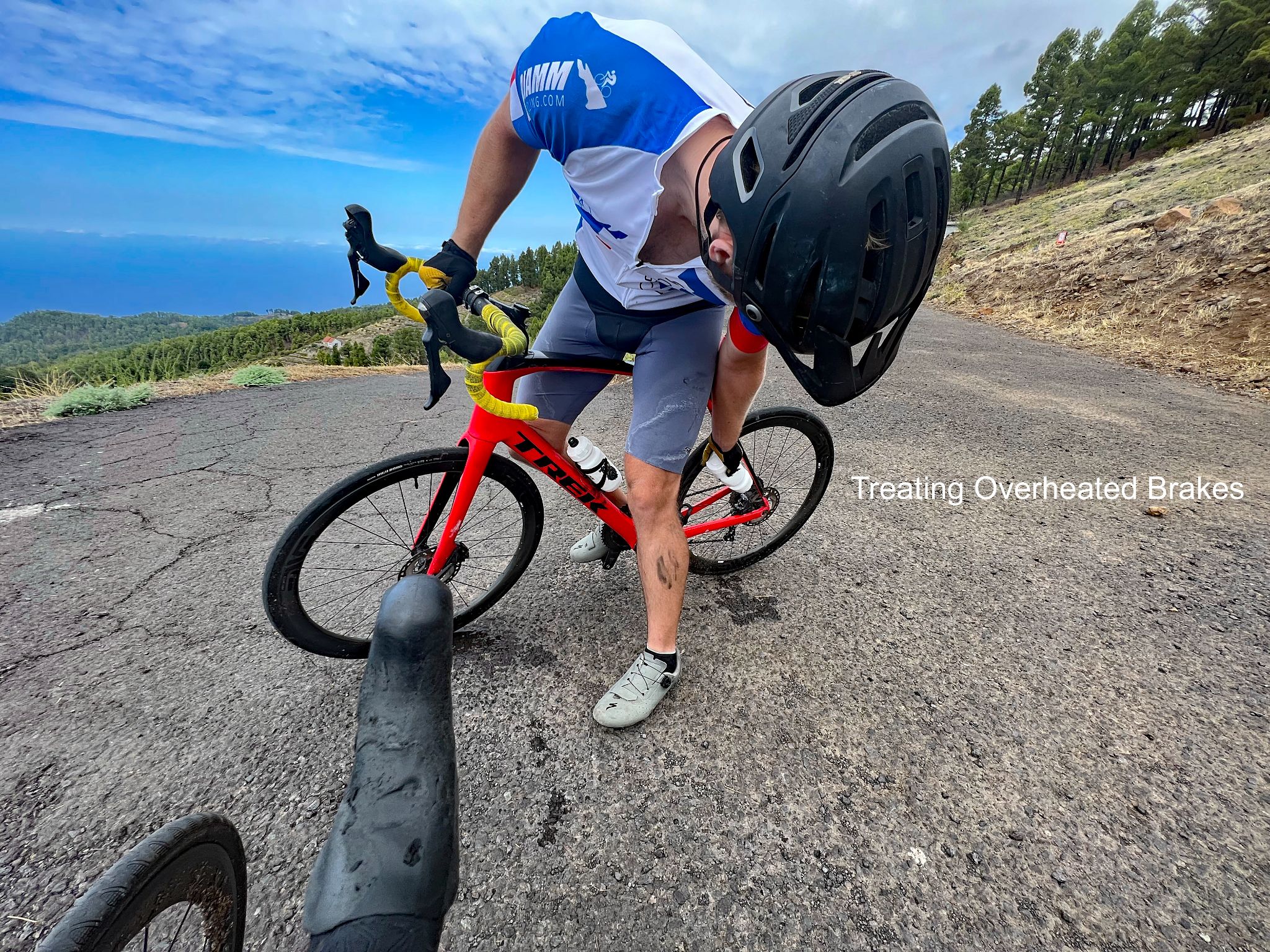 PJAMM Cyclist stops on route to treat his overheated breaks