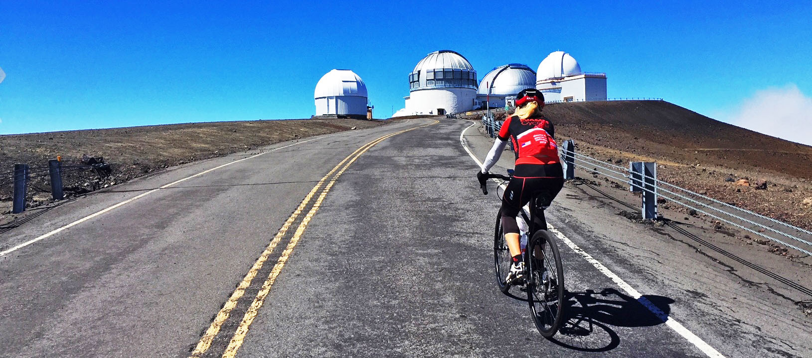 Riding bike at the top of Mauna Kea above the clouds. 