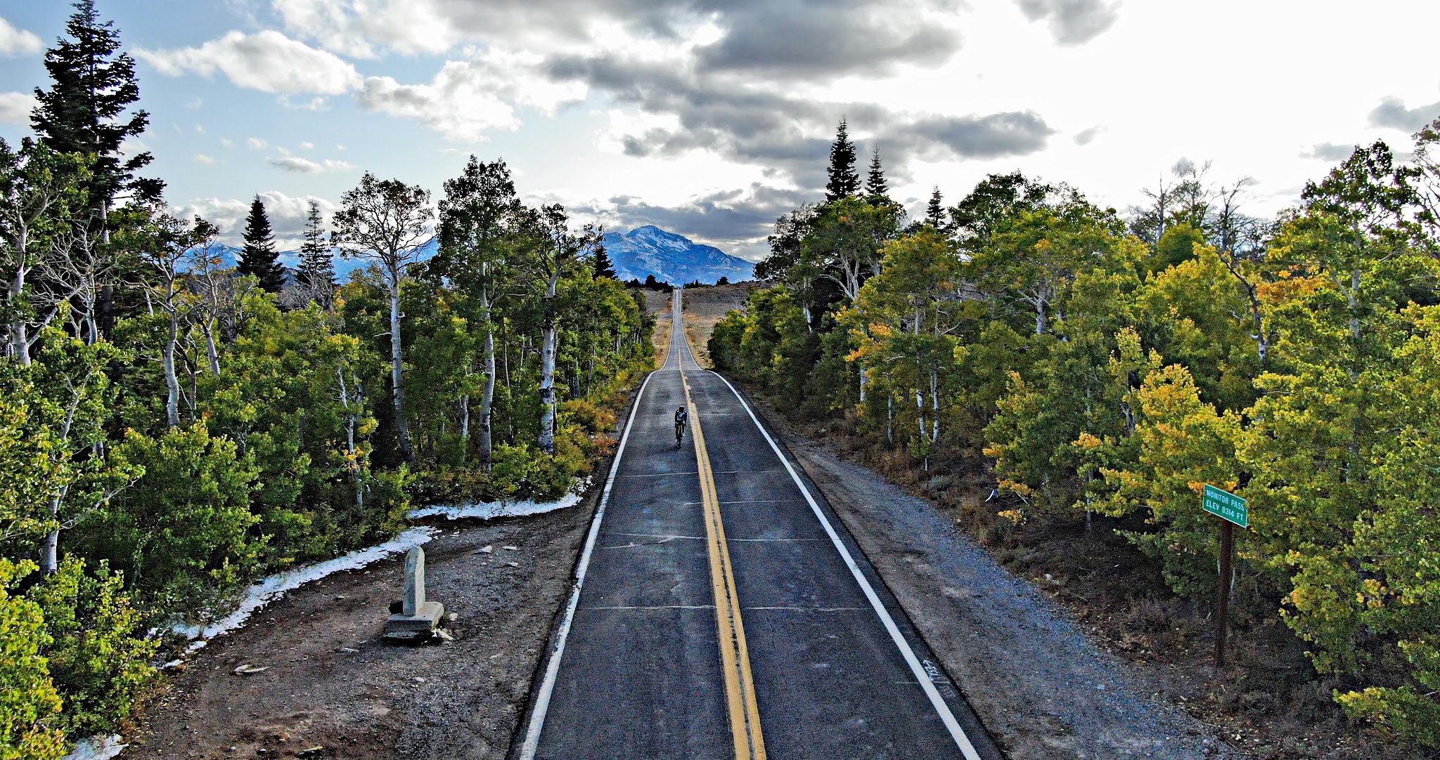 Cycling Monitor Pass East - aerial drone photo of long straight stretch of road looking west from the pass