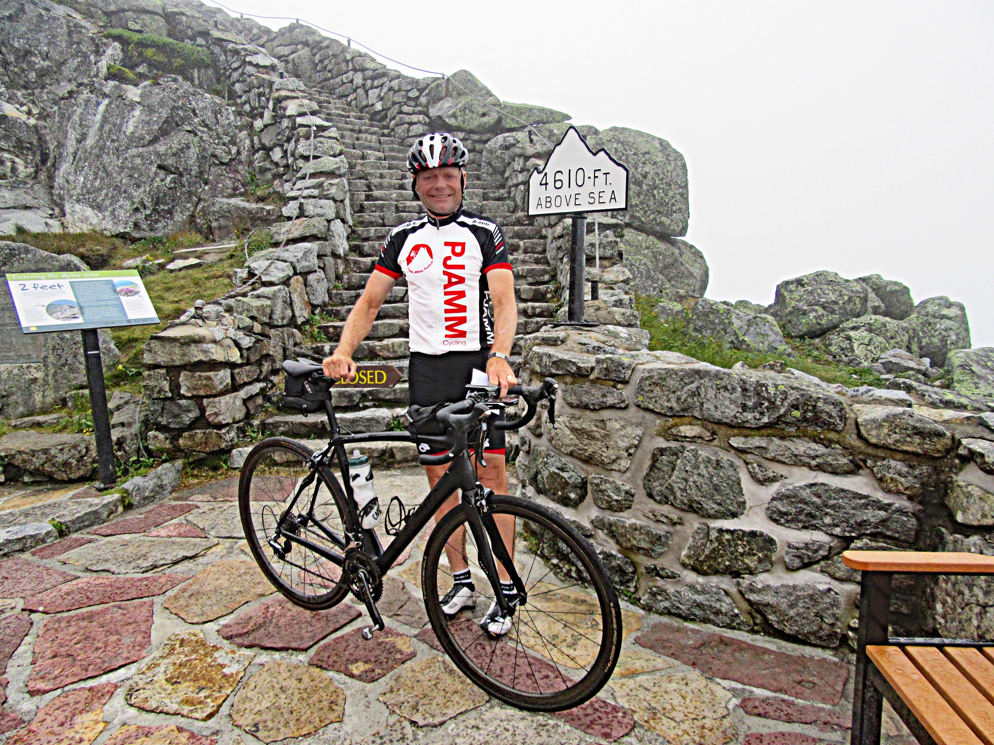 Cycling Whiteface Mountain - finish - pjamm cycling john johnson with bike 