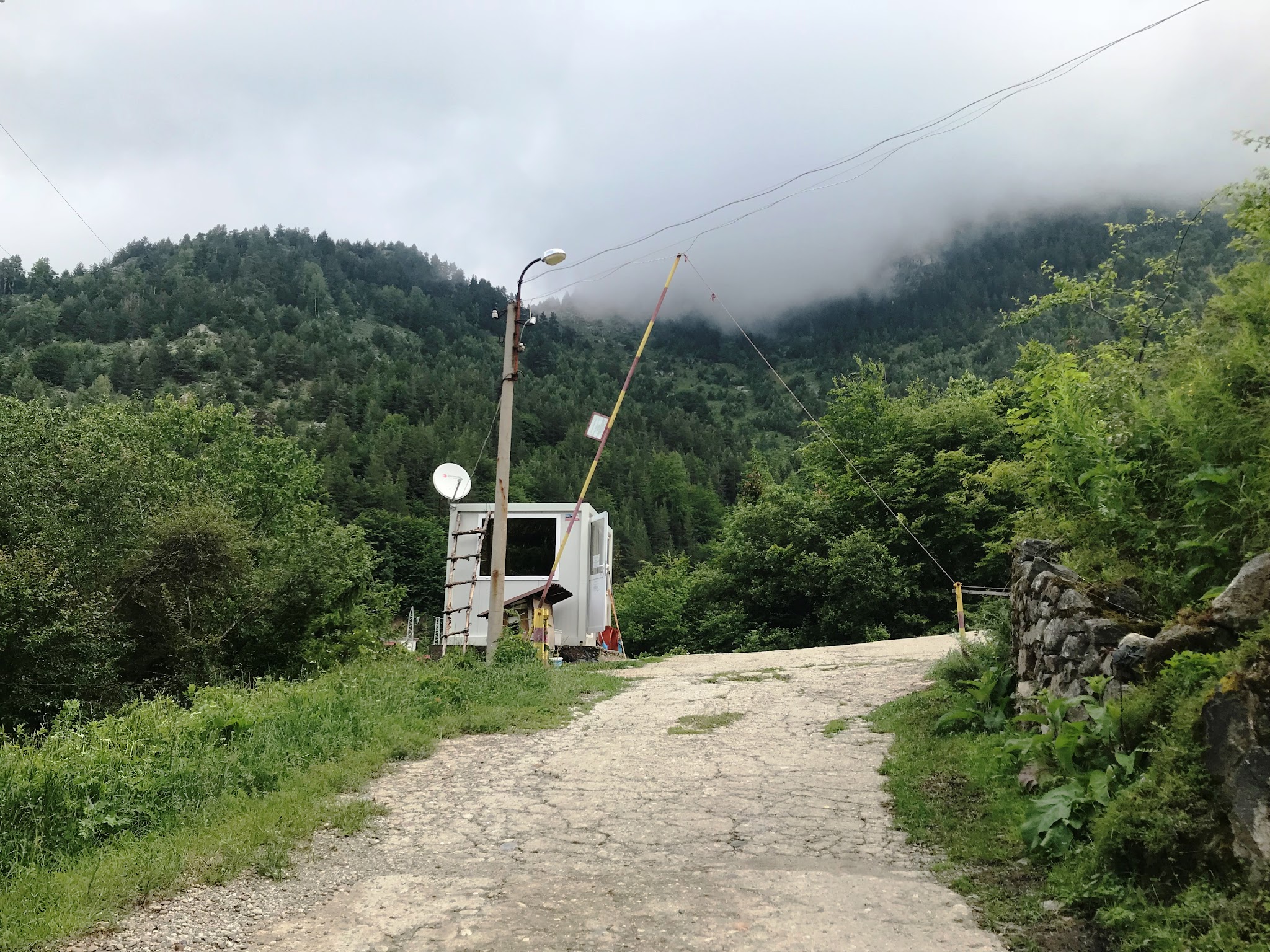 Guard shack and gate on bicycle climb up Rila