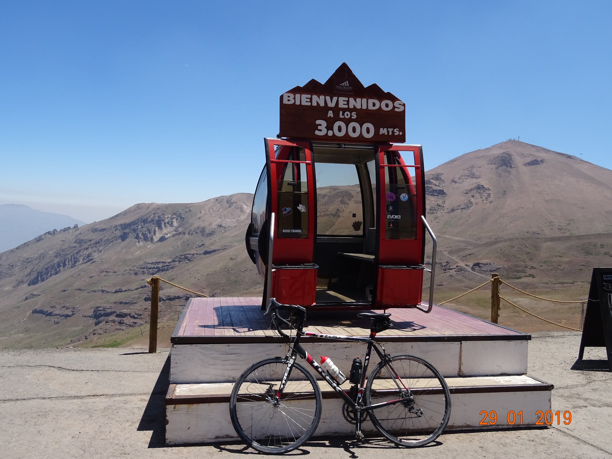Valle Nevado Cycling Valle Nevado - cycle leaning against altitude sign and gondola