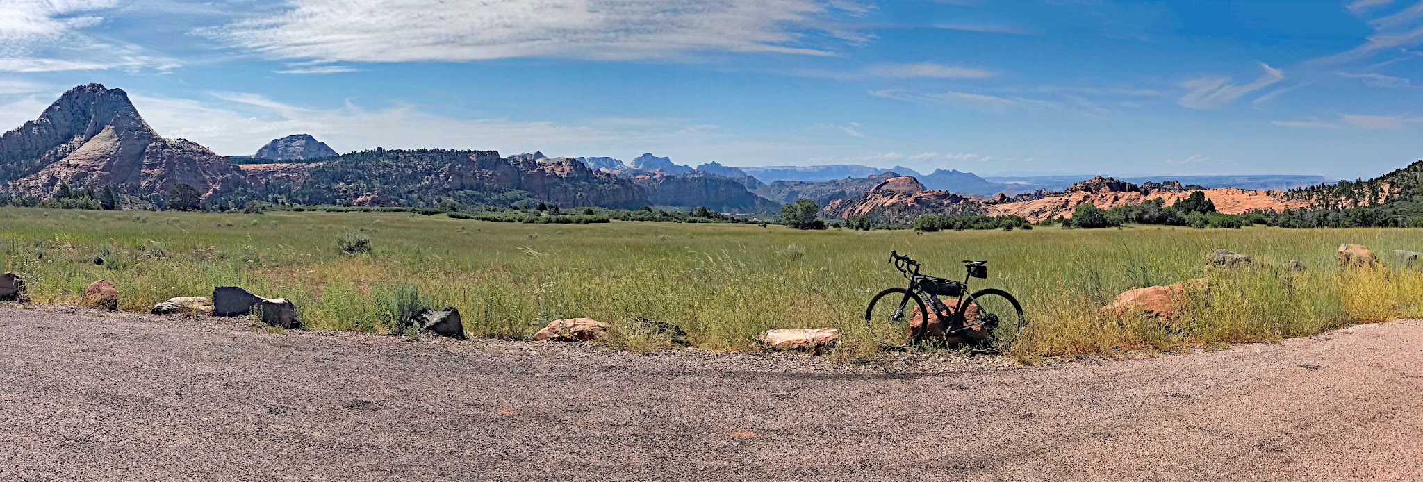 Bicycle ride up Kolob Terrace - red rock mountain formations bike and roadway