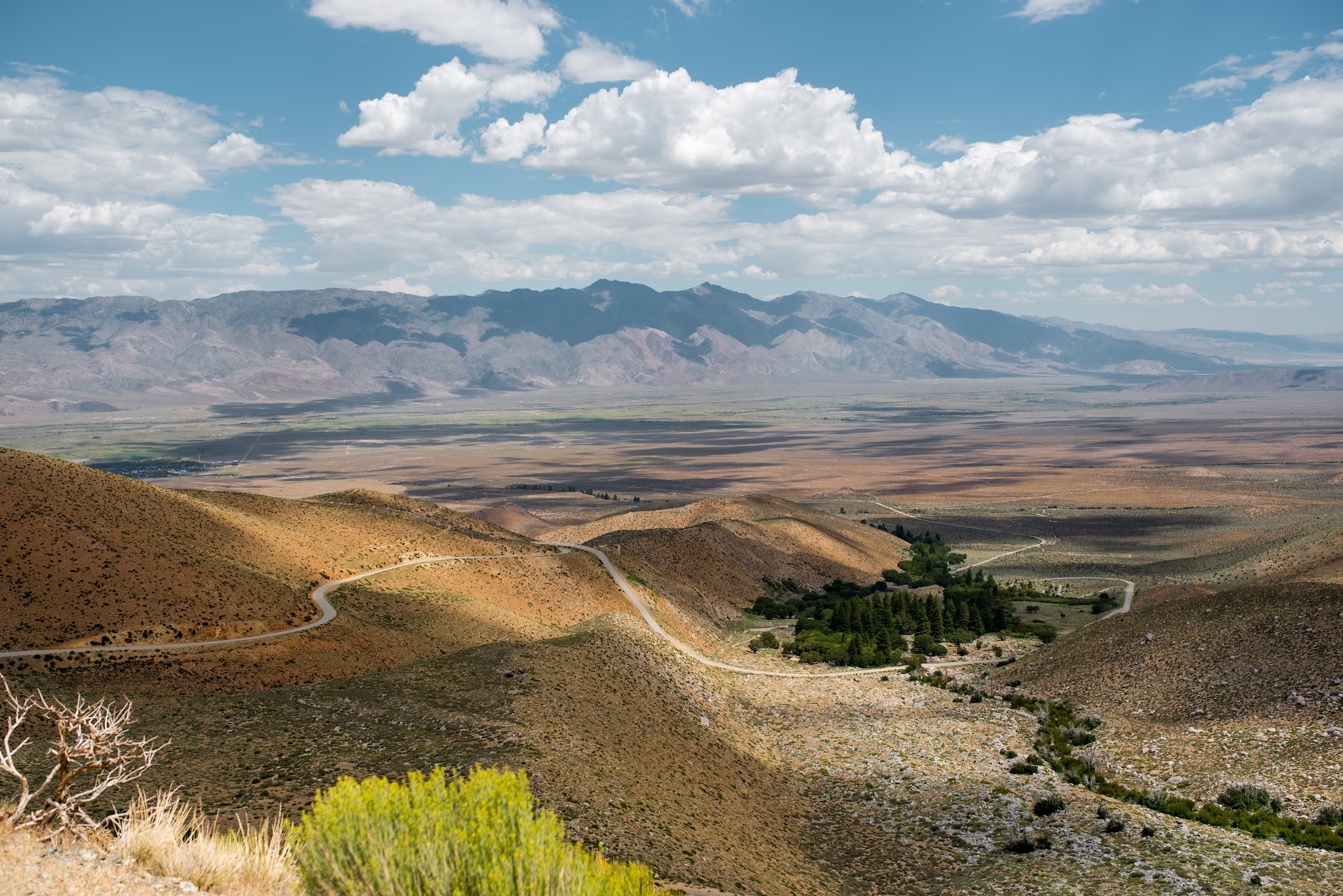 Cycling Owens Valley - Onion Valley Road, hairpins, valley mountains, clouds and sky
