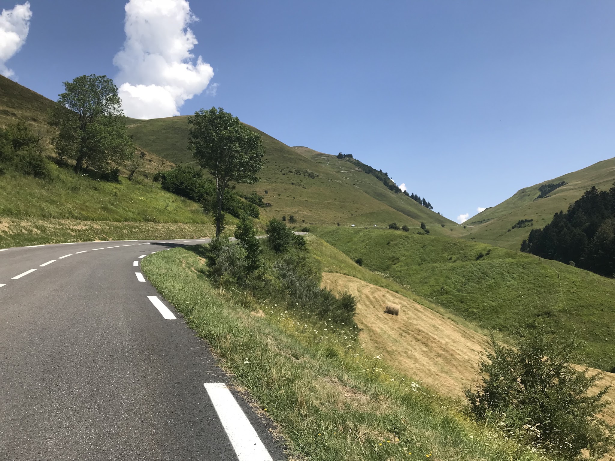 Bicycle climb of Génos-Loudenvielle - roadway with pass in distance