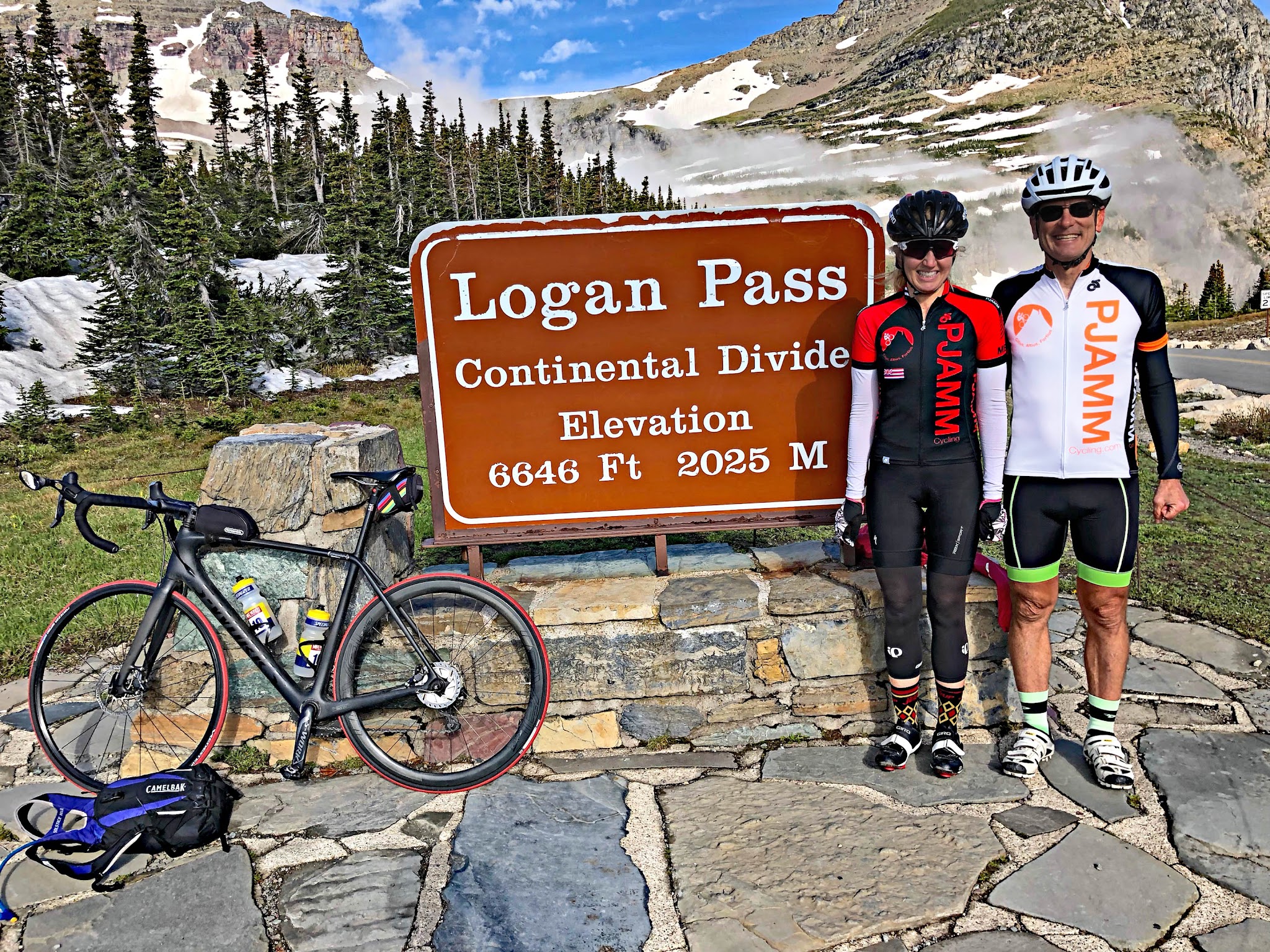 Bicycling Going to the Sun Road - Logan Pass - PJAMM Bruce Hamilton and Stacy Topping at the pass and continental divide
