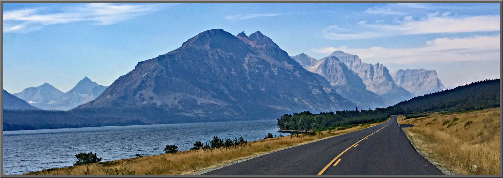 Climbing by bike Going to the Sun Road - Logan Pass - Saint Mary Lake, road, mountains