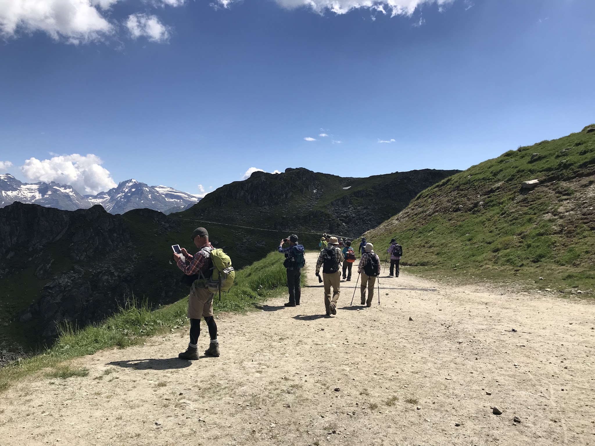 Climbing Marjalensee  by bike - hikers on road