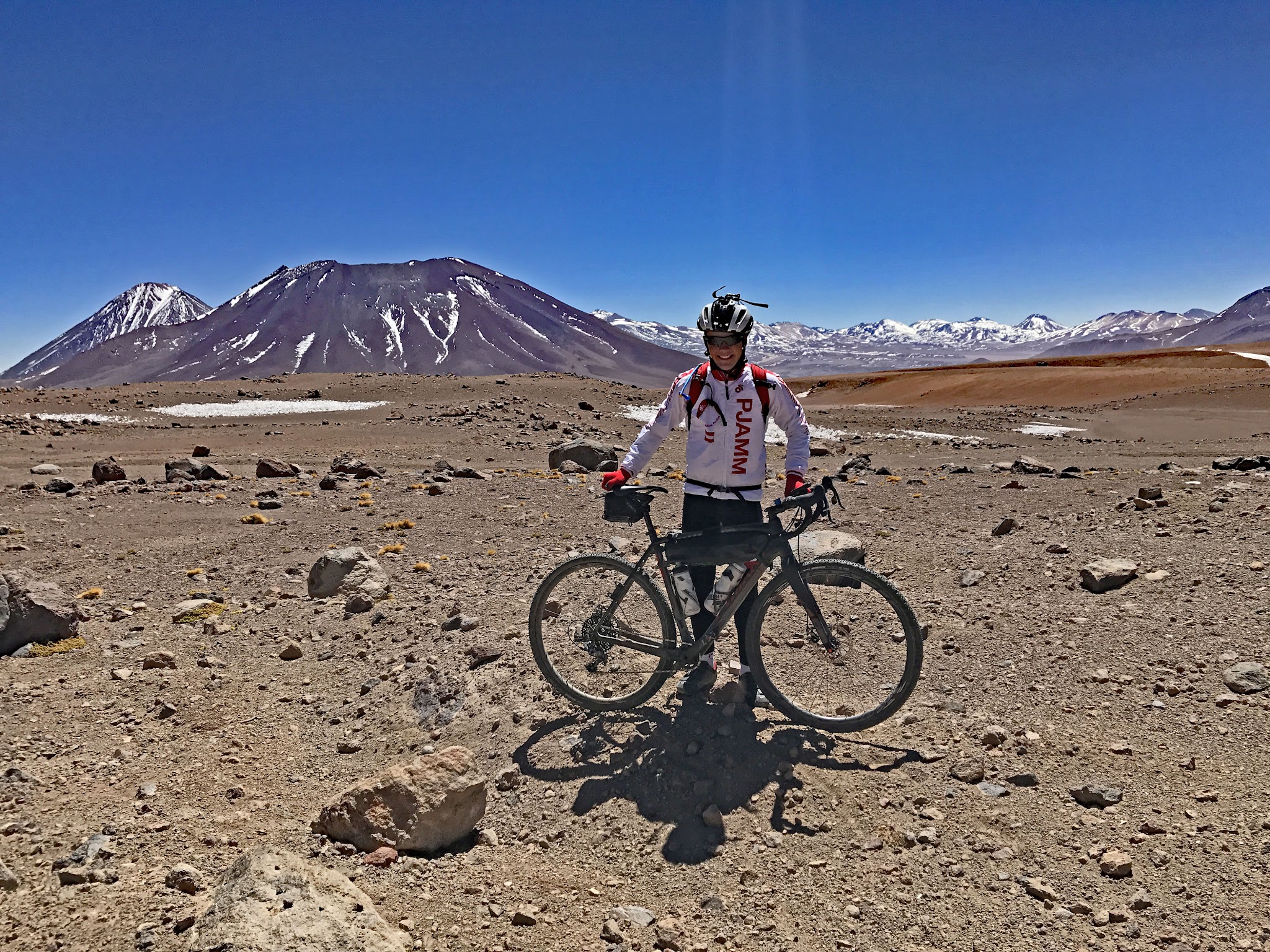 Cycling Hwy 27, Atacama, Chile - PJAMM cycling Brad Butterfield at finish with bike