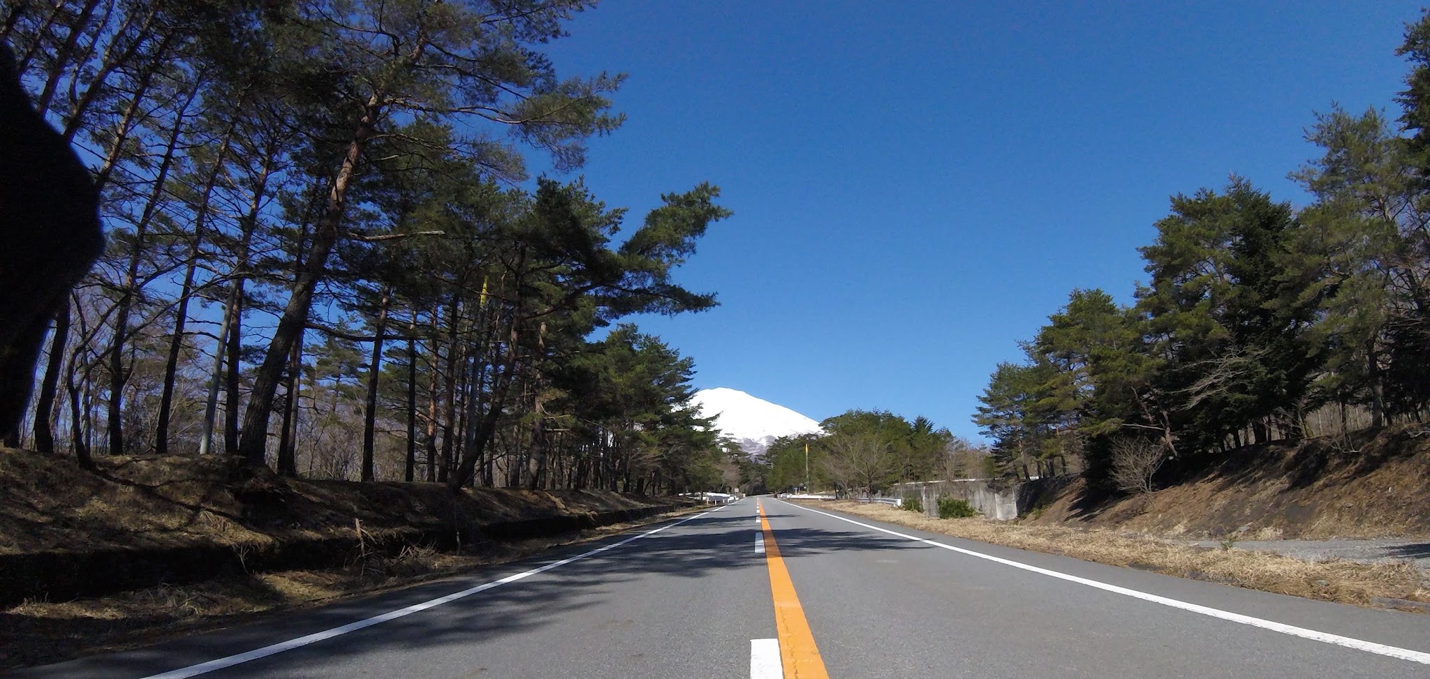 Bike climb Mt. Fuji Azami Line - start - roadway and Mt. Fuji
