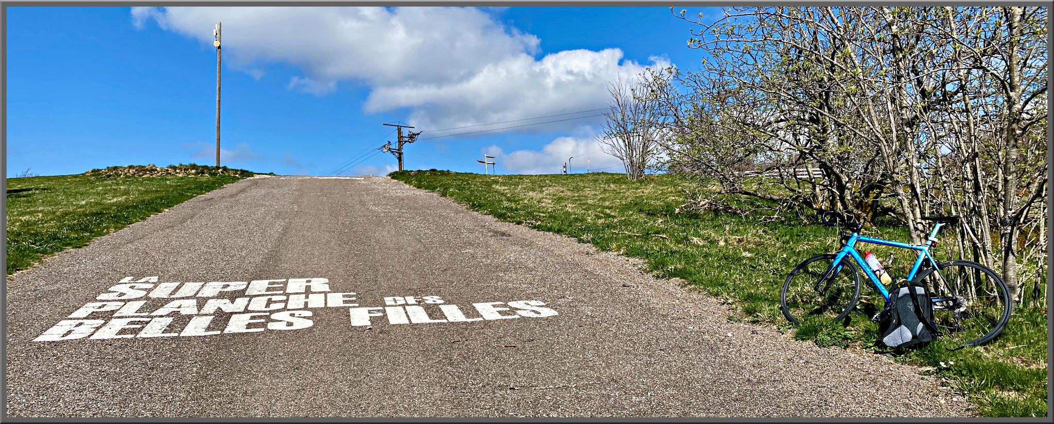 roadway stenciled with SUPER PLANCHE DES BELLES FILLES