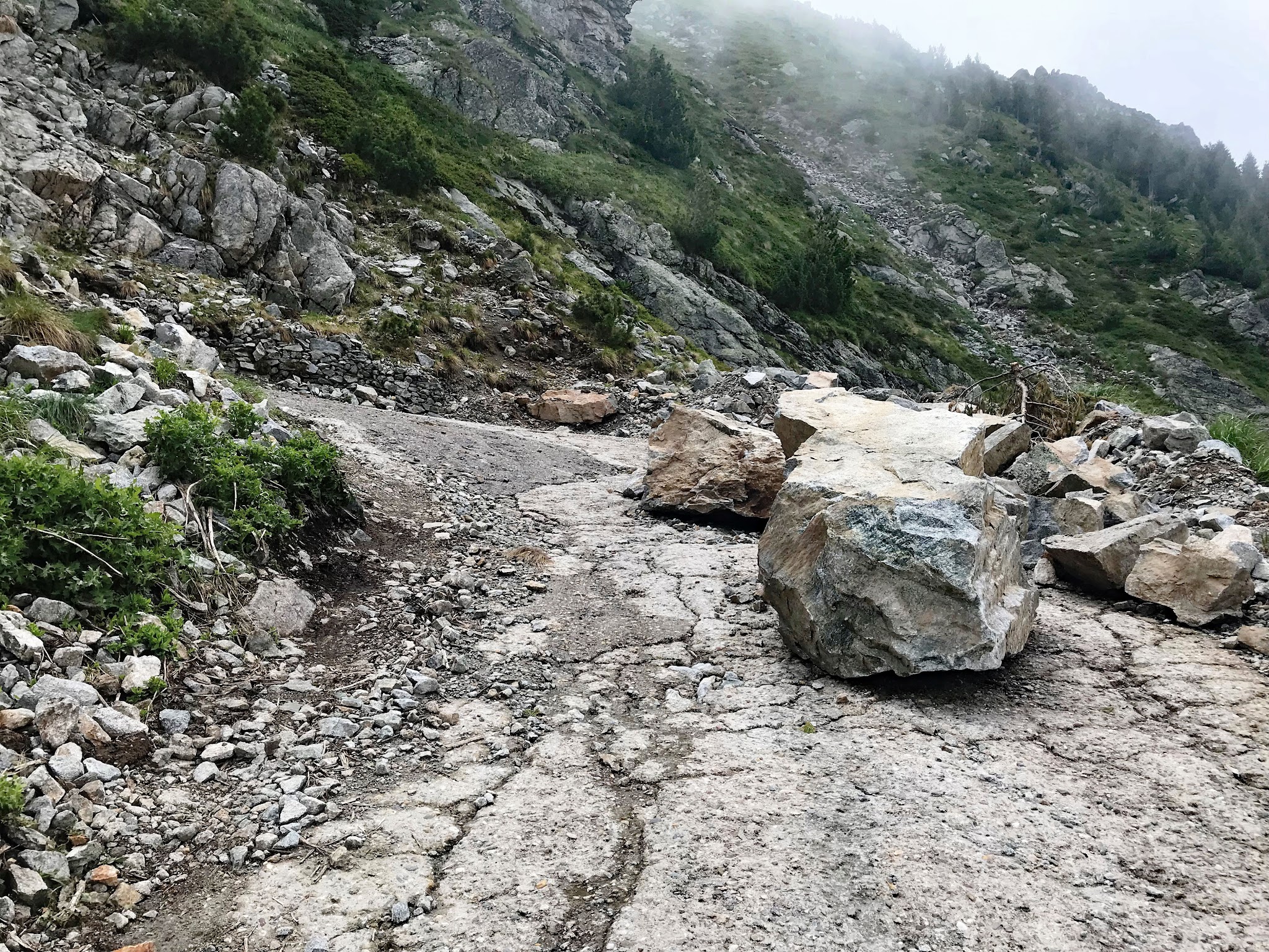 Rocks on road on Rila bike climb