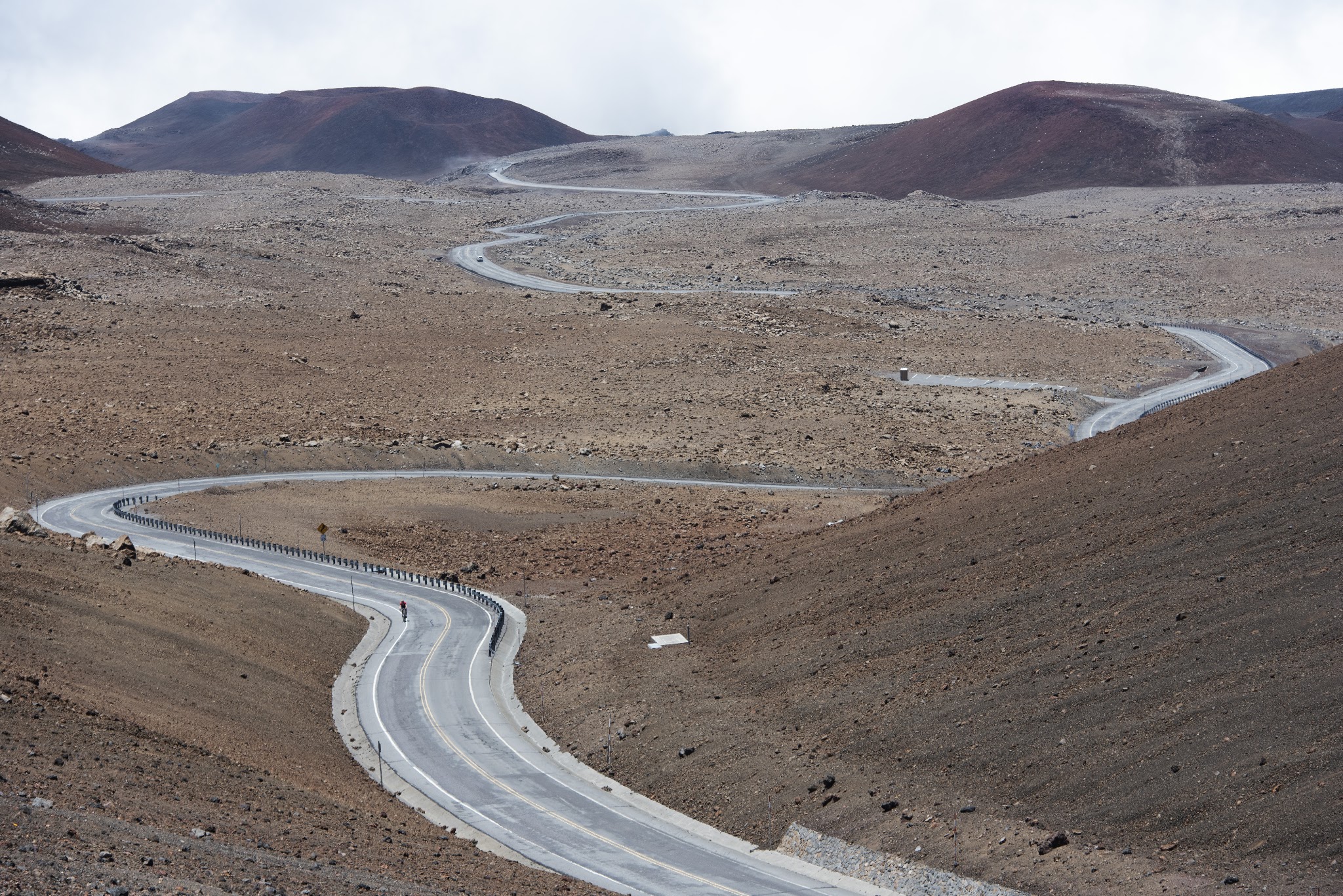 Cycling Highest bike climbs in the world - road, volcano, clouds on Mauna Kea - 