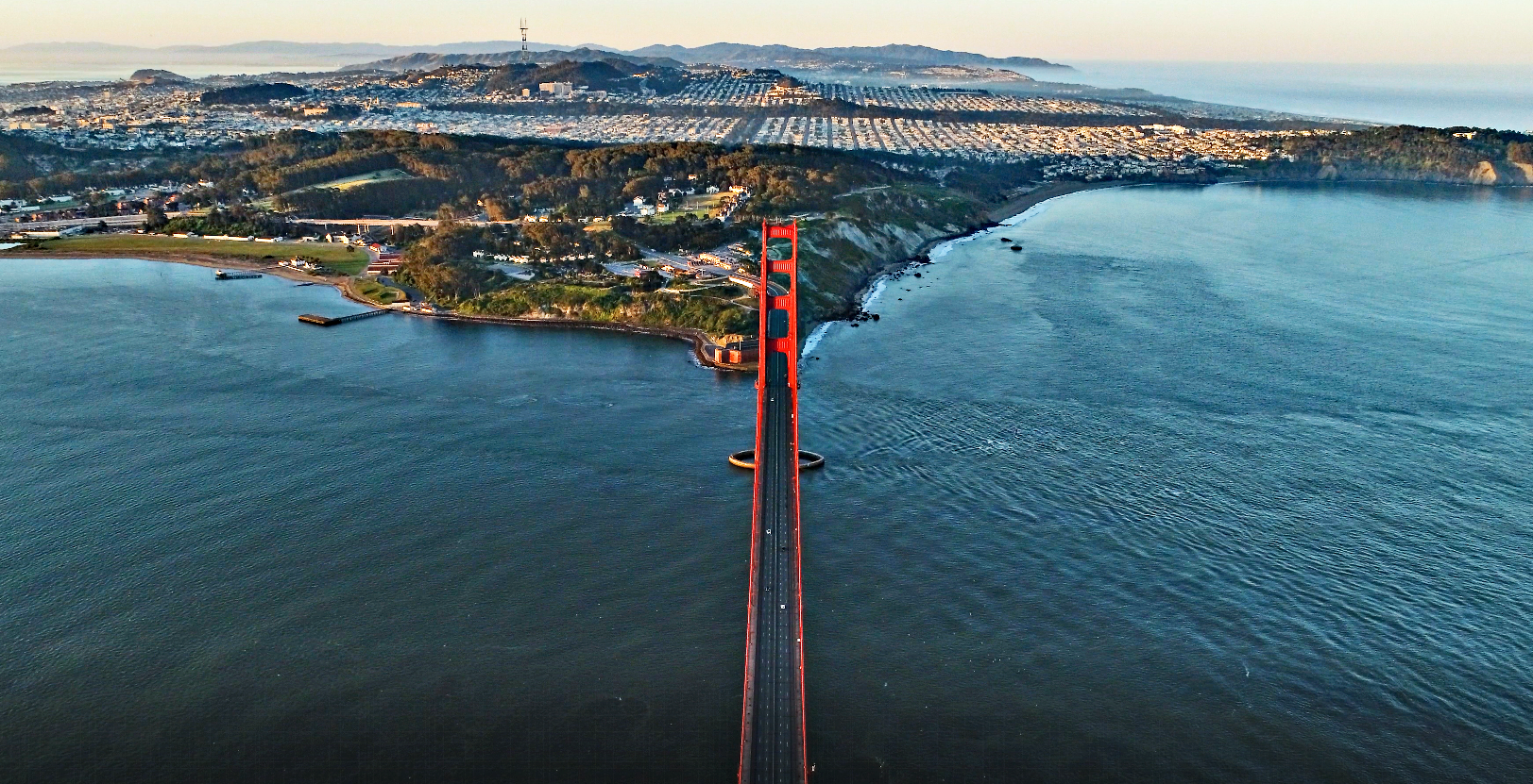Cycling Golden Gate Bridge to Mt. Tam, California Cycling Golden Gate Bridge to Mt. Tam, California - panoramic aerial view of bright blue waters of the bay, and Golden Gate Bridge spanning it
