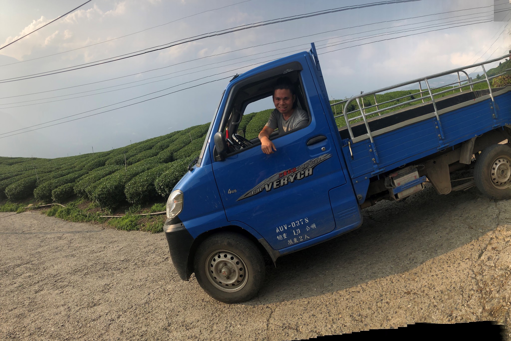 Climbing Wuling Pass North by bike - little truck on steep road