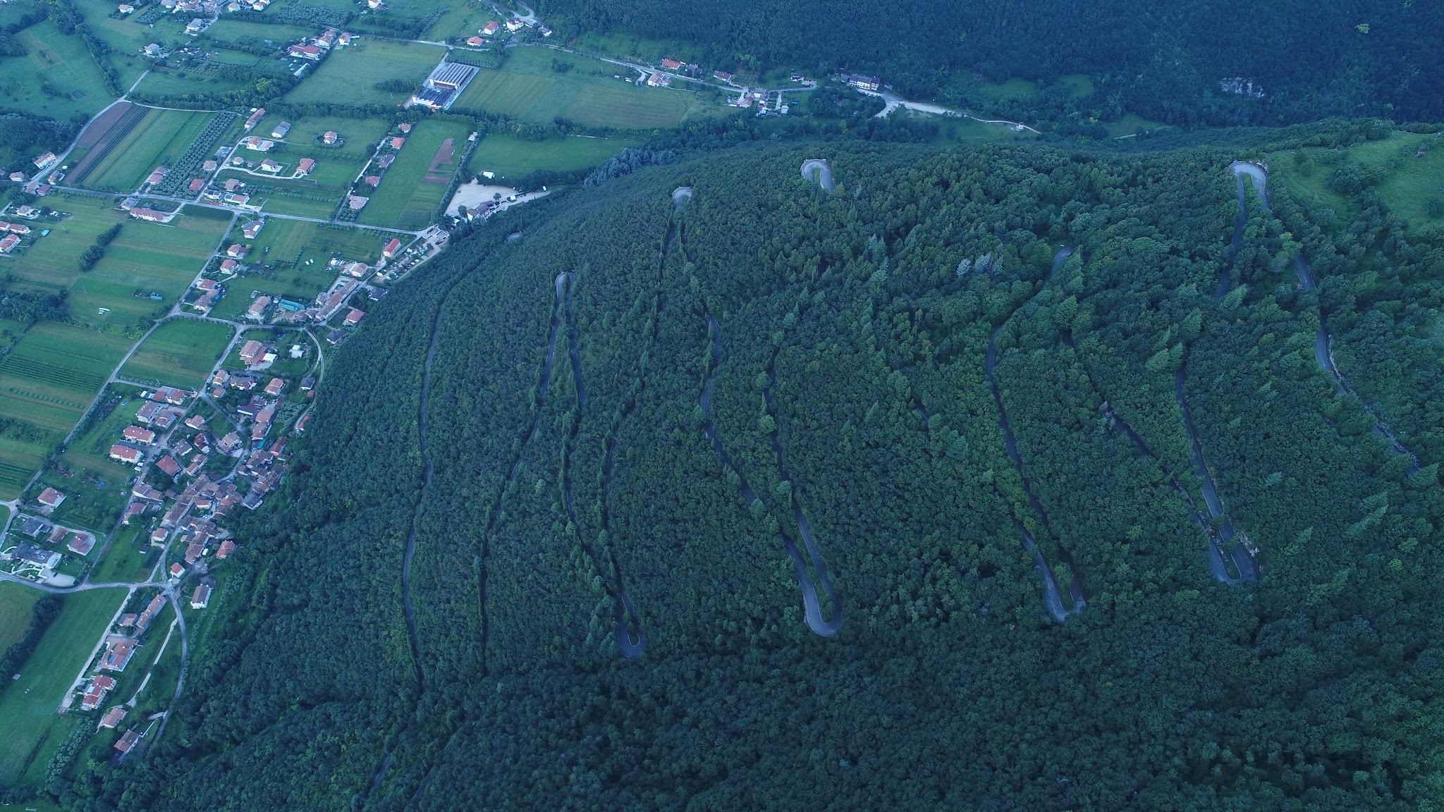 Cycling Monte Grappa from Semonzo - aerial drone photo of hairpins and forest