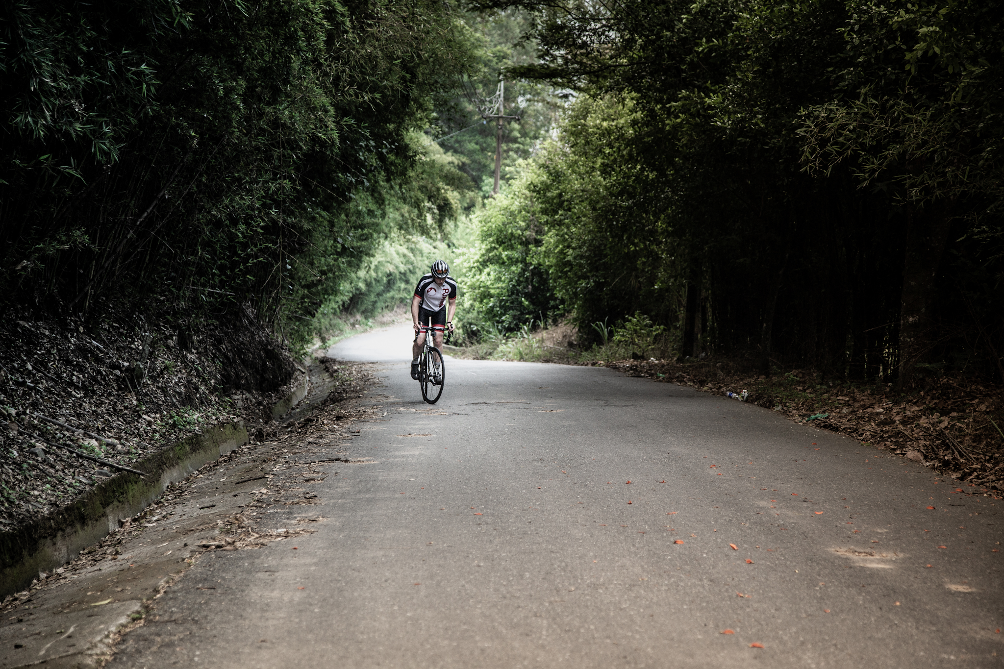 Bicycle climb El Limonar - pjamm cyclist standing on bike on road
