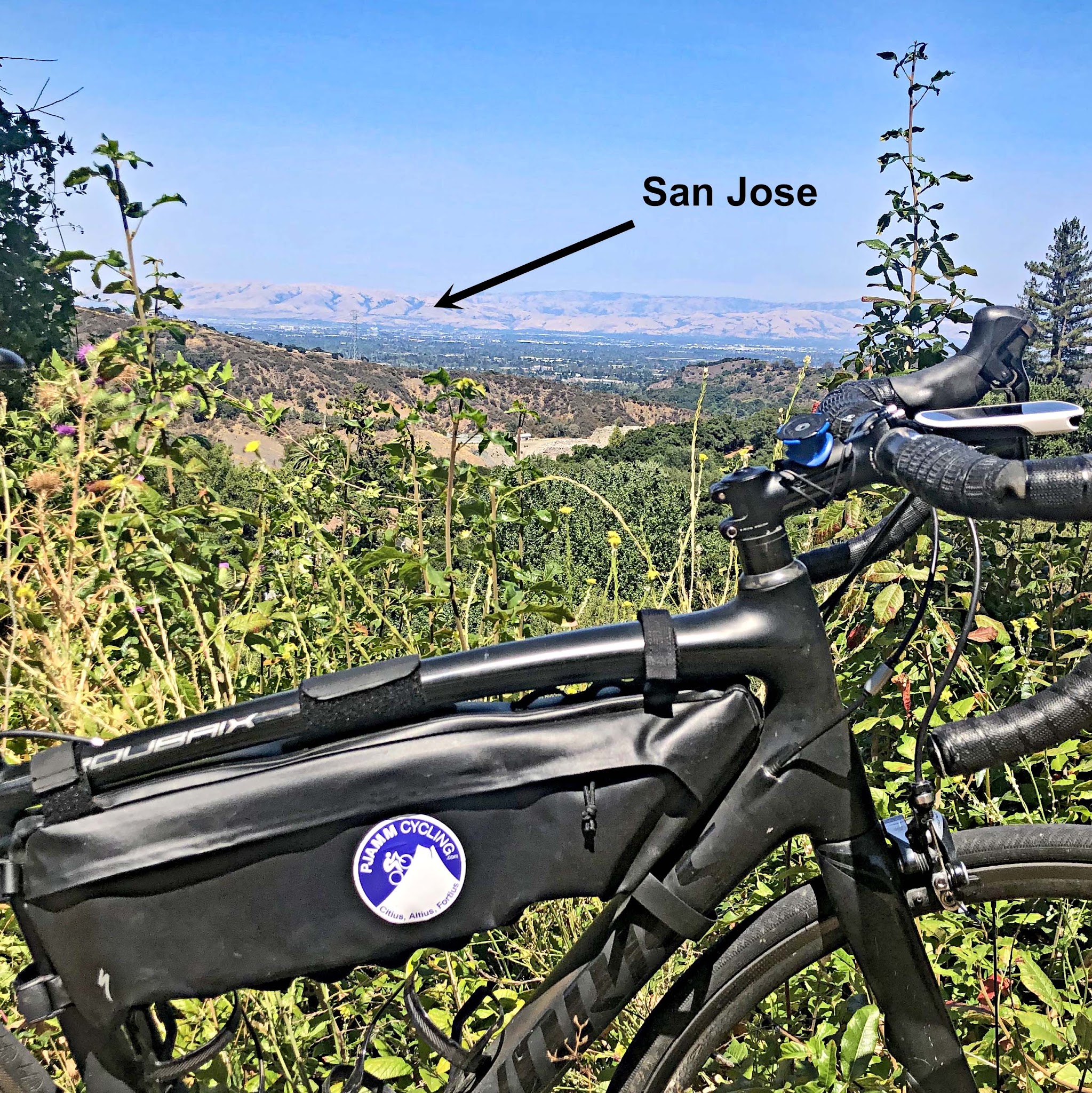Cycling Montebello, Santa Cruz Mountains, California - bike parked in greenery along hillside overlooking Silicon Valley and San Jose