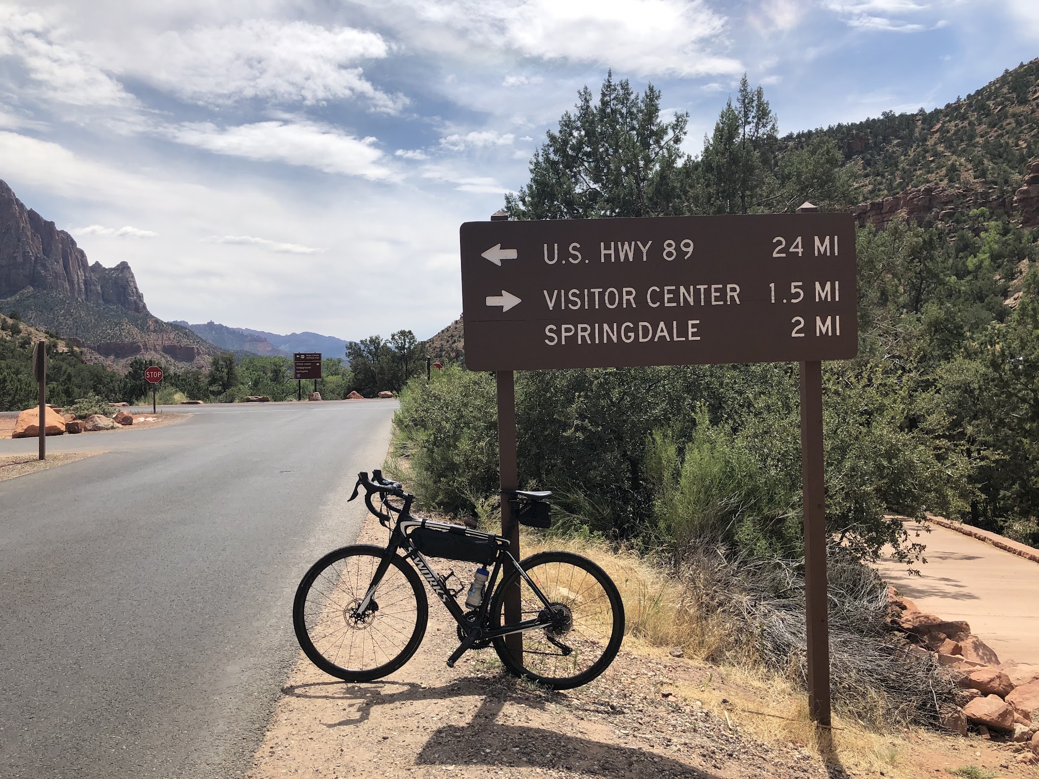 Hwy 9 to Zion Tunnel Cycling Hwy 9 to Zion Tunnel - bike leaning against road sign at start