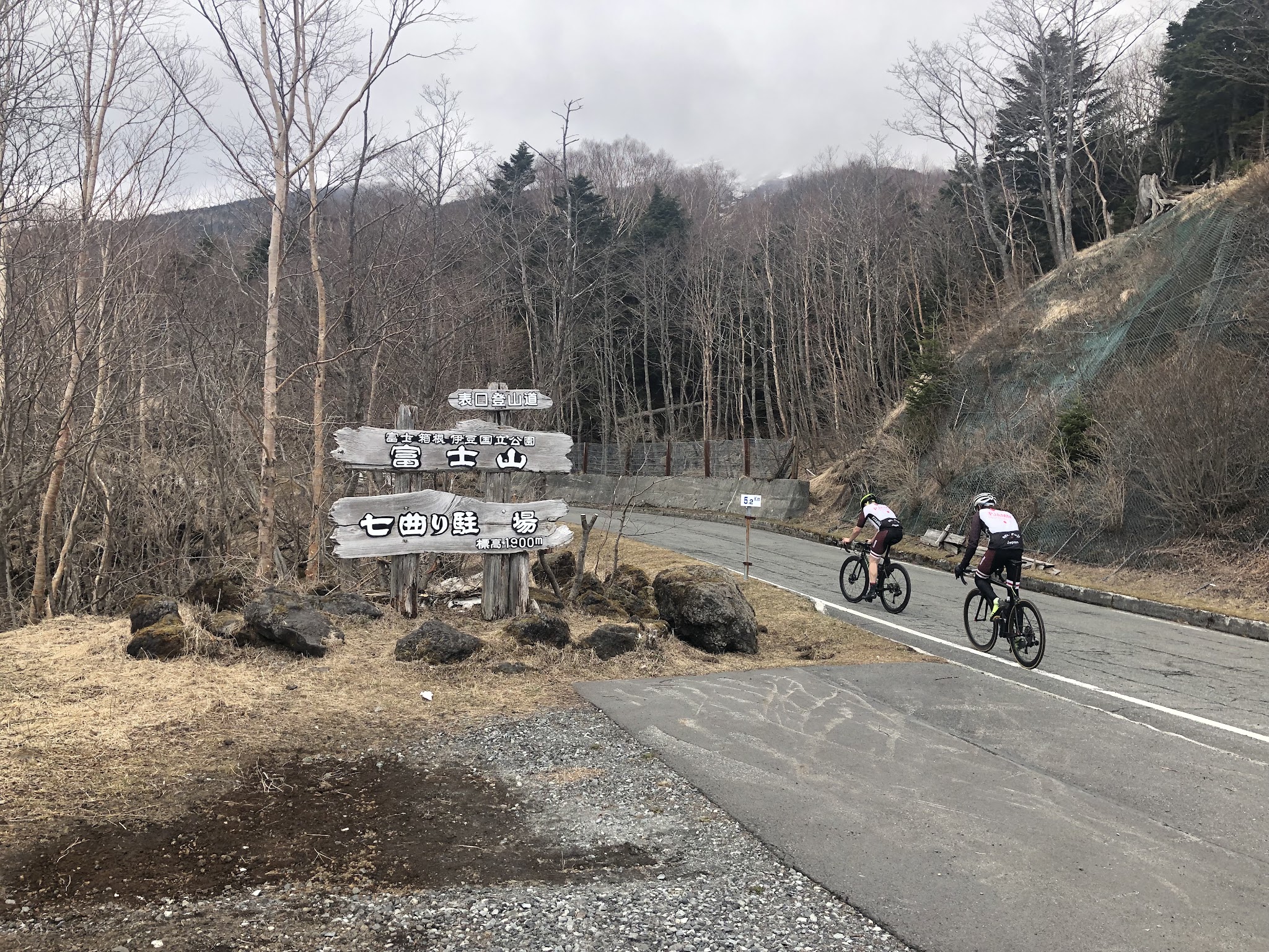 Cycling Mt. Fuji - Fujinomiya Line - 2 cyclists riding past road sign