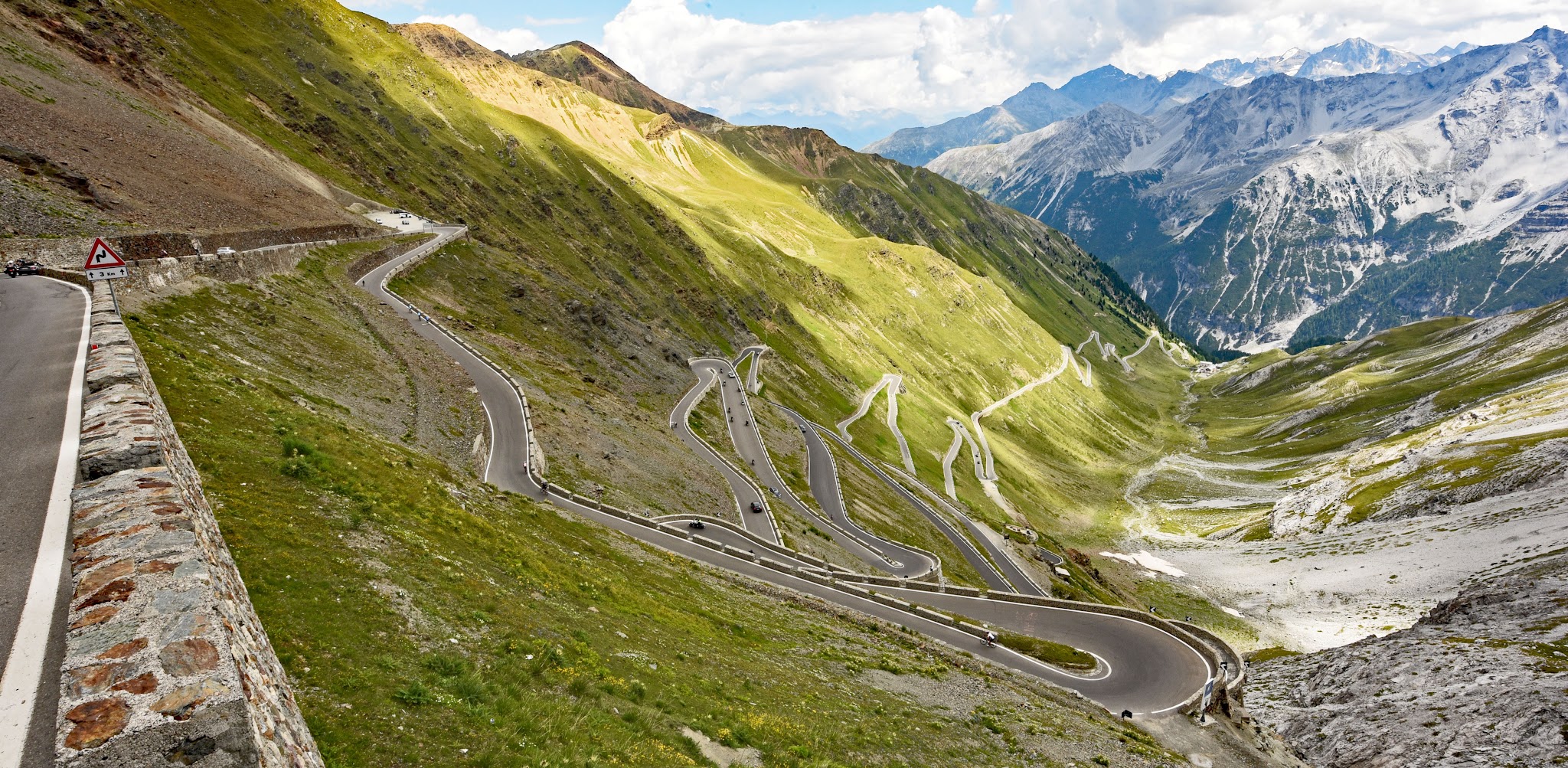 Climbing Passo dello Stelvio by bike - hairpins (tornanti) as seen from the top of the climb