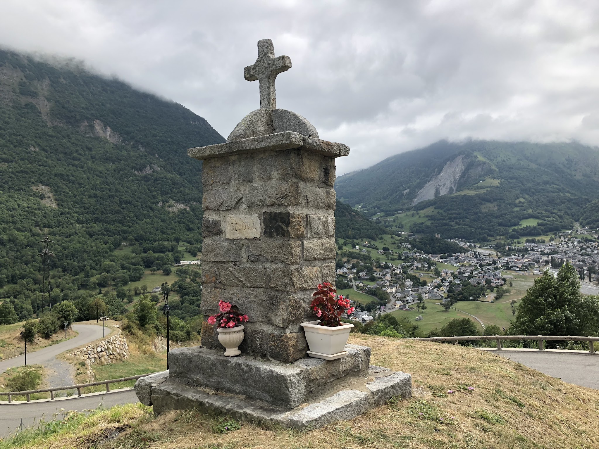 Bike climb Luz Ardiden - memorial with Luz-Saint-Sauveur in background
