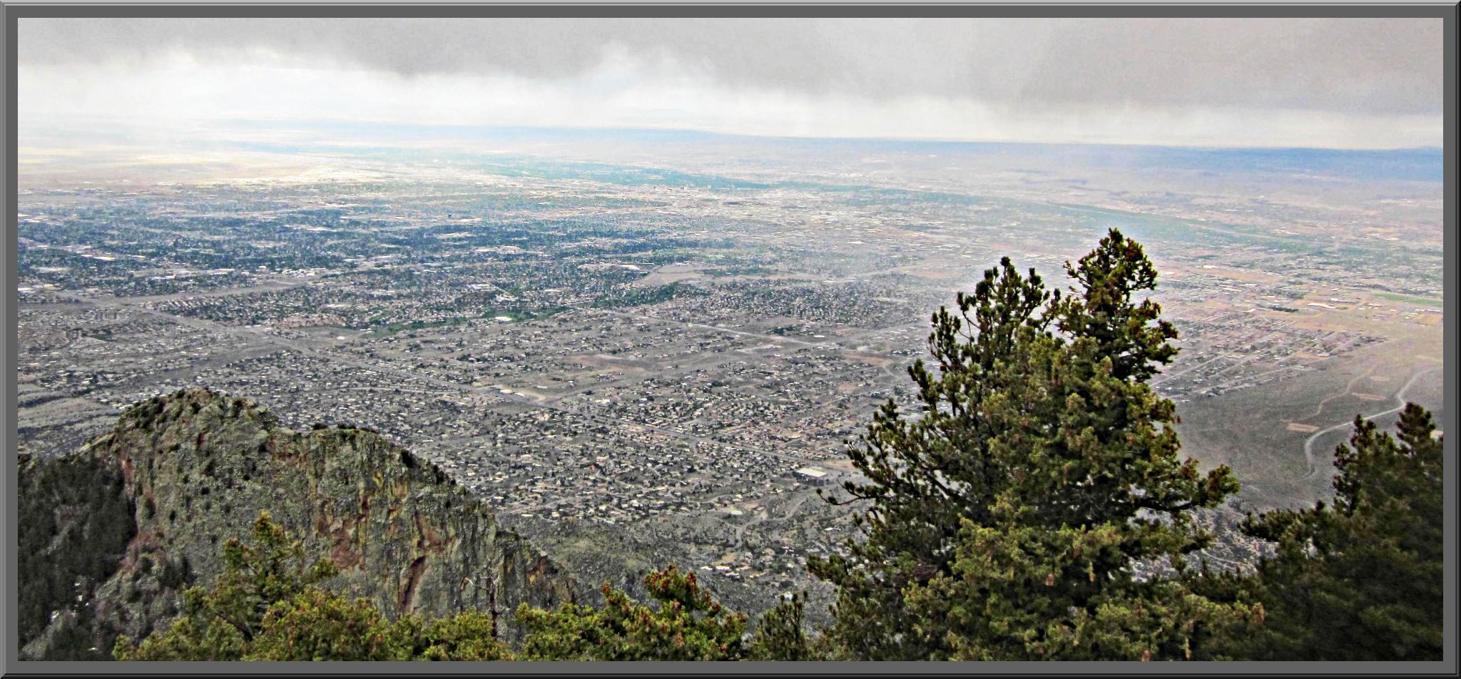 View looking down from the top of Sandia Crest, looking down on suburbs below