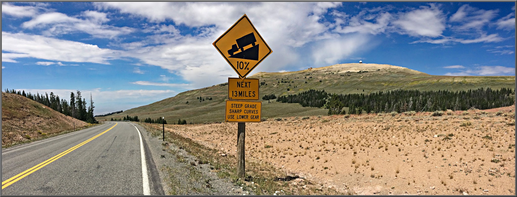 Cycling Alternate Route 14, Wyoming - sign for 10% grade next 13 miles