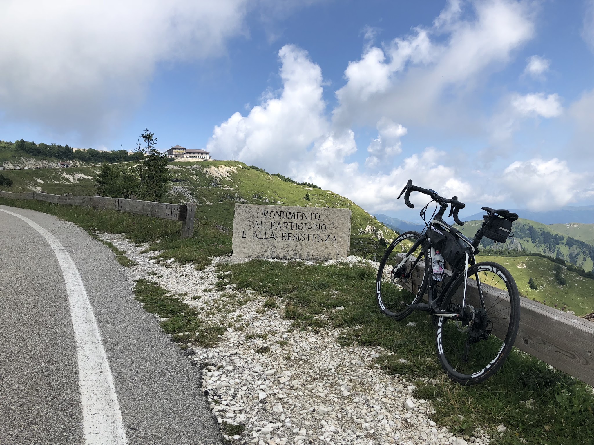 Bicycling Monte Grappa - Cavaso del Tomba - WW I memorial bike leaning against it, rifugio