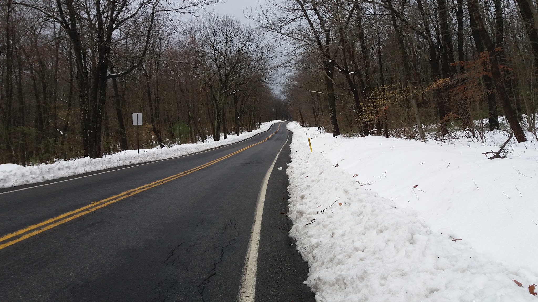 Cycling Route 44 East, Pennsylvania - two-lane straight portion of roadway surrounded by snow