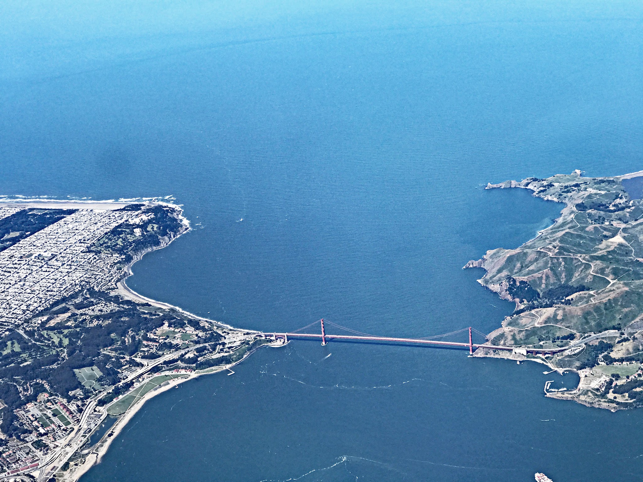 Cycling Golden Gate Bridge to Mt. Tam, California Cycling Golden Gate Bridge to Mt. Tam, California - view from airplane looking over Golden Gate Bridge spanning the bay, from Marin to San Francisco