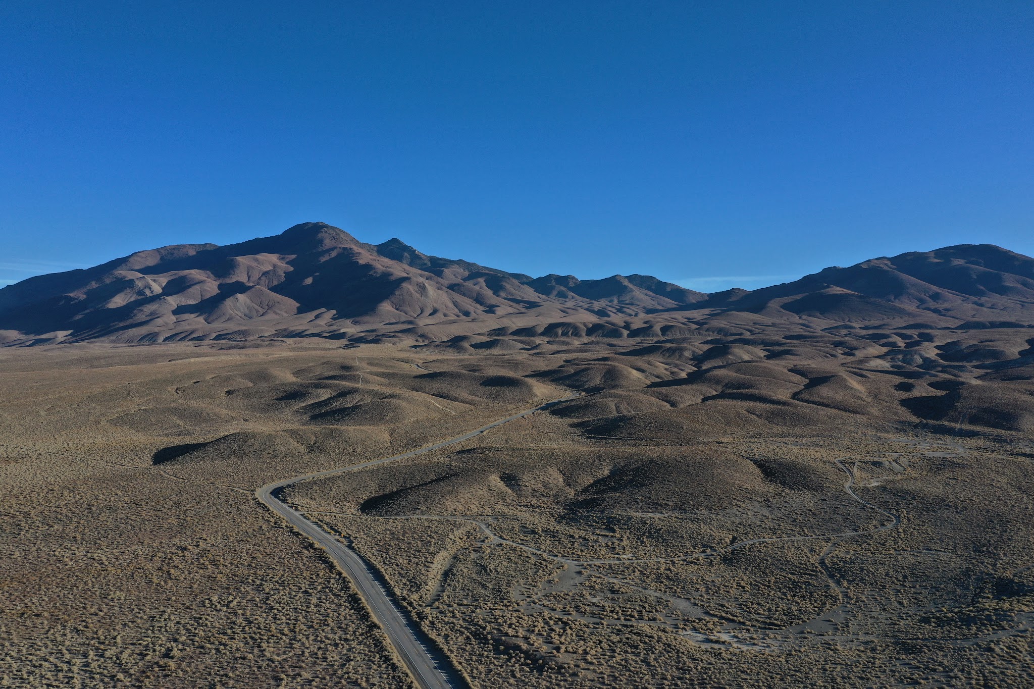 Bicycle climb of White Mountain  - roadway, center stripe, hwy 168, mountains