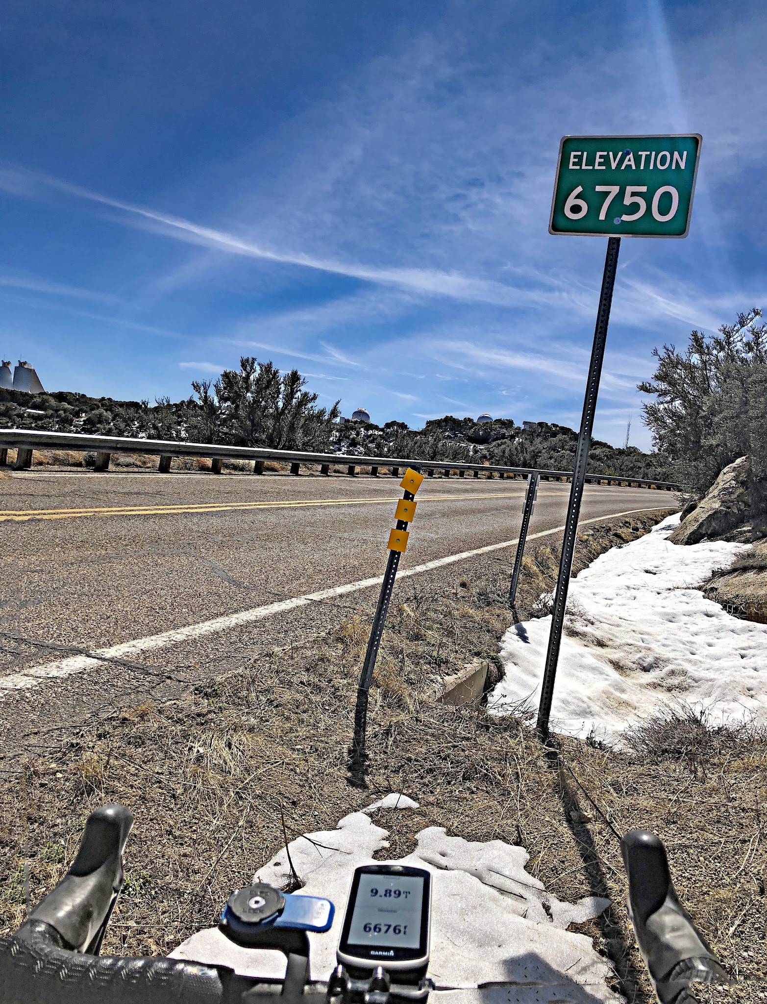 Climbing by bike Kitt Peak - 6,750' sign