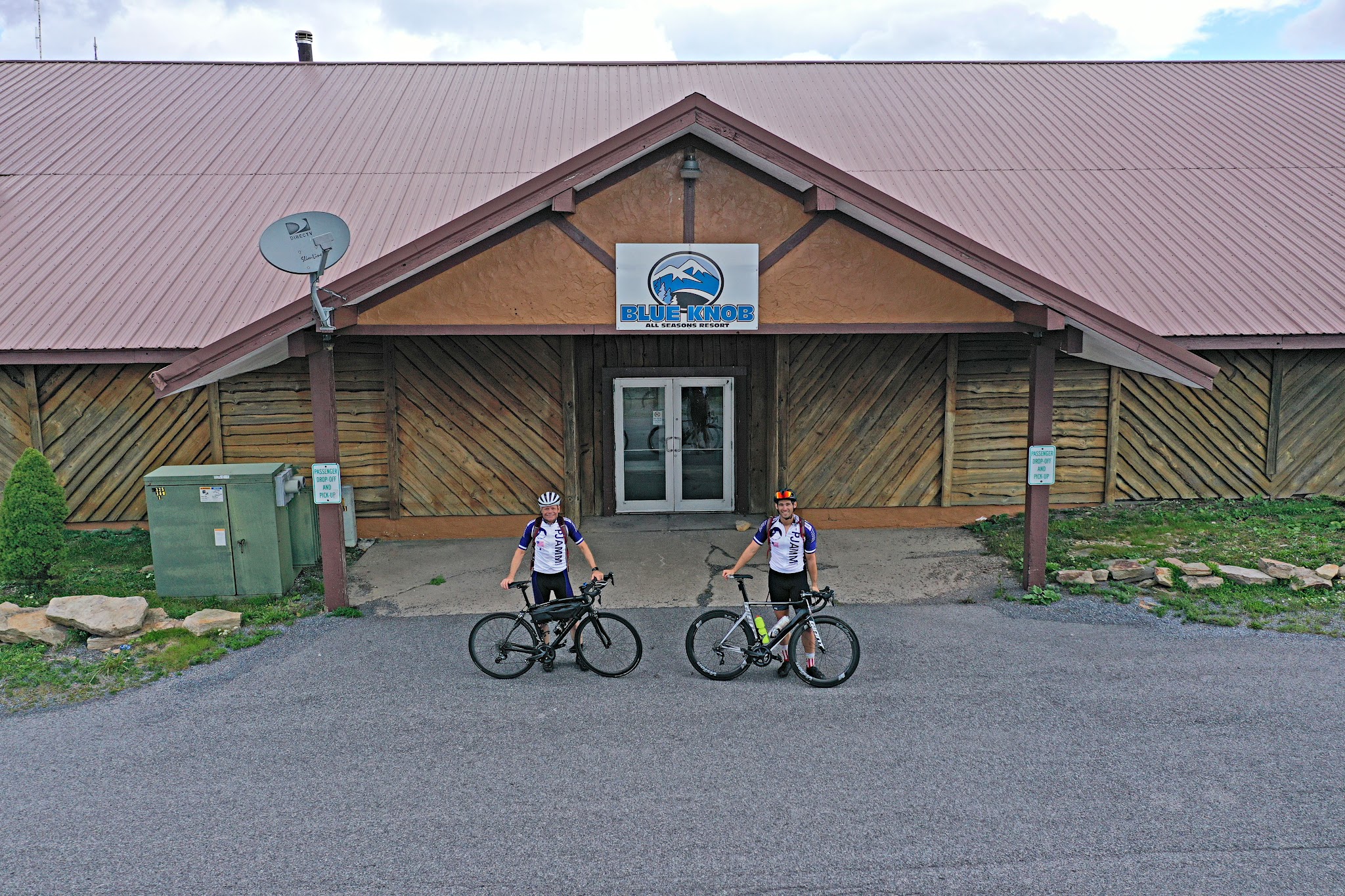Cycling Pavia Road, Blue Knob State Park, Pennsylvania - two PJAMM Cyclists stand with bikes in front of Blue Knob All Seasons Resort
