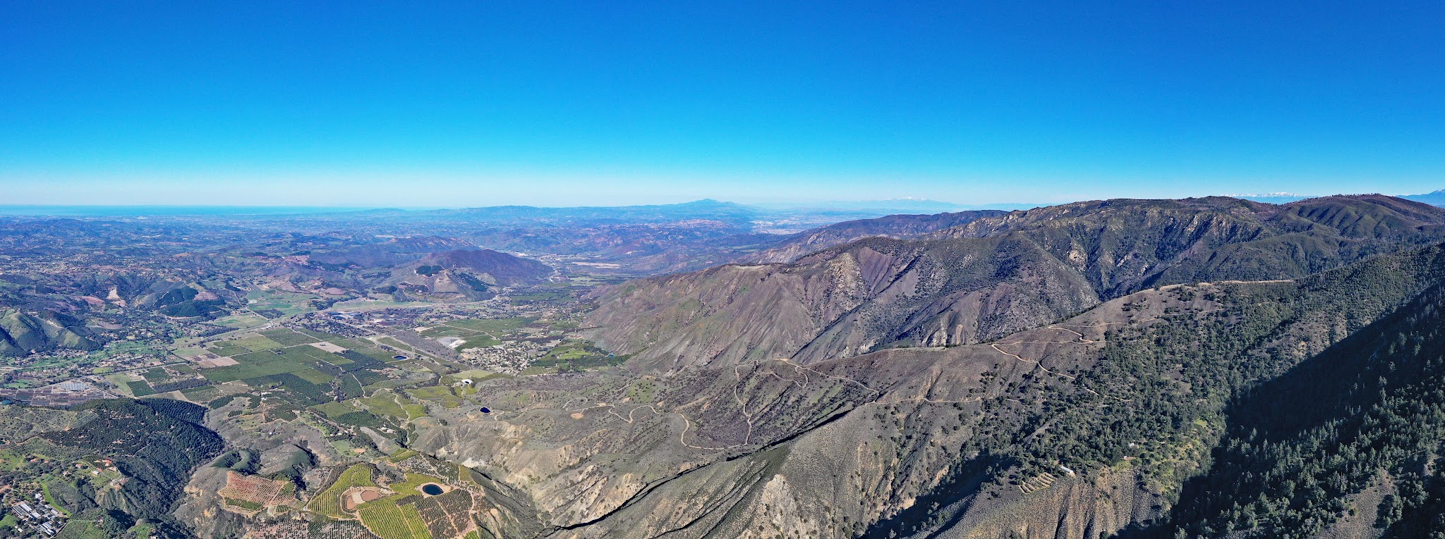 Cycling US Most Epic Bike Climbs - Nate Harrison Grade - cyclist with Pauma Valley in background