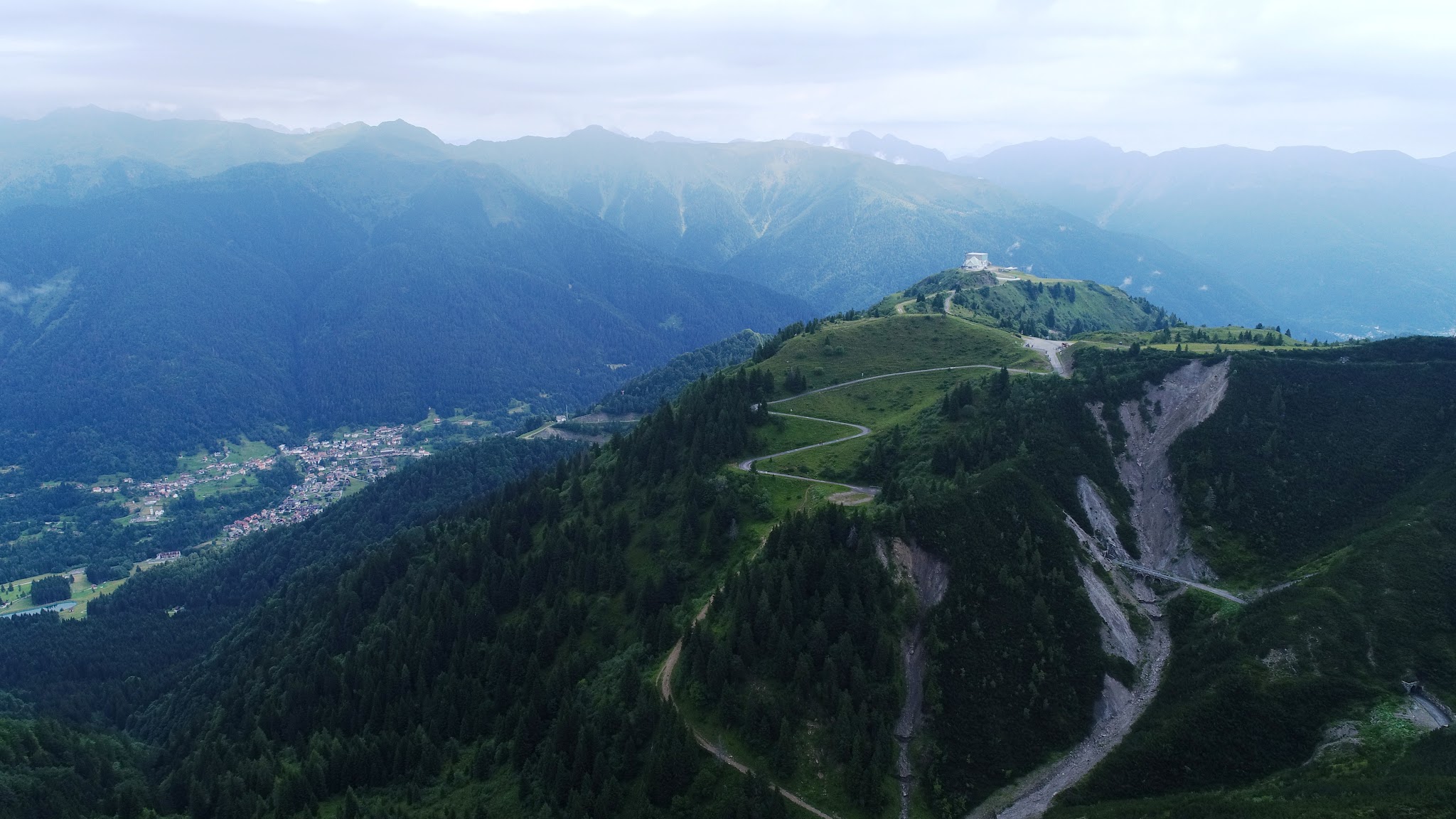 Monte Zoncolan from Ovaro - tunnel from air Bicycle ride of Monte Zoncolan from Ovaro - cyclist passing roadway sign