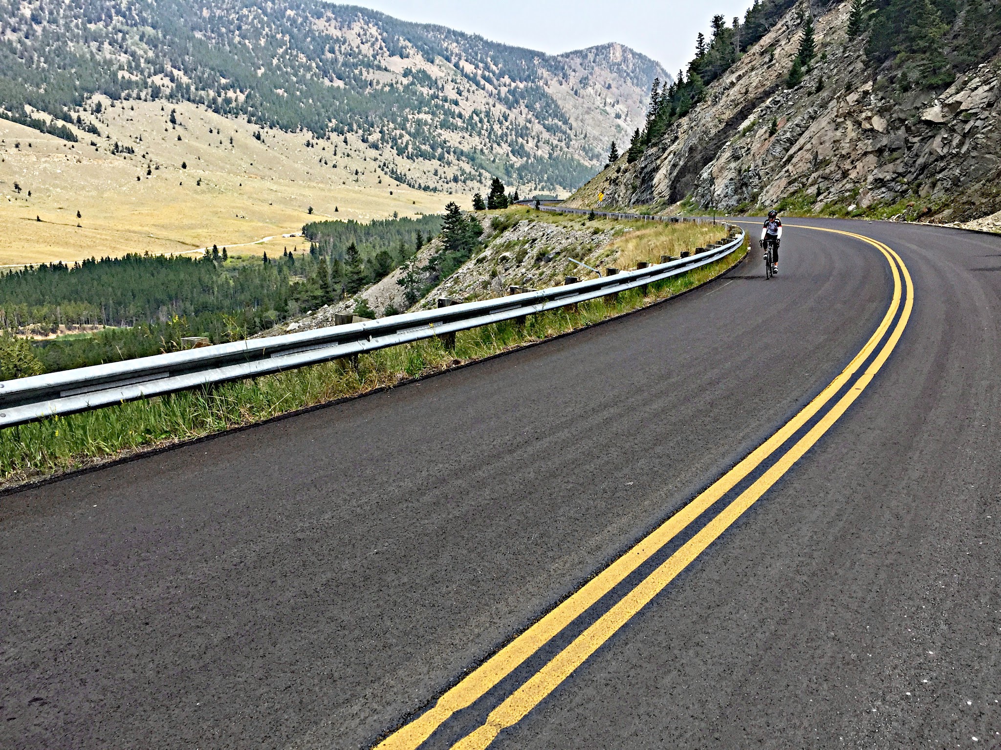 Bike climb Bear Tooth Pass North - cyclist on perfect road