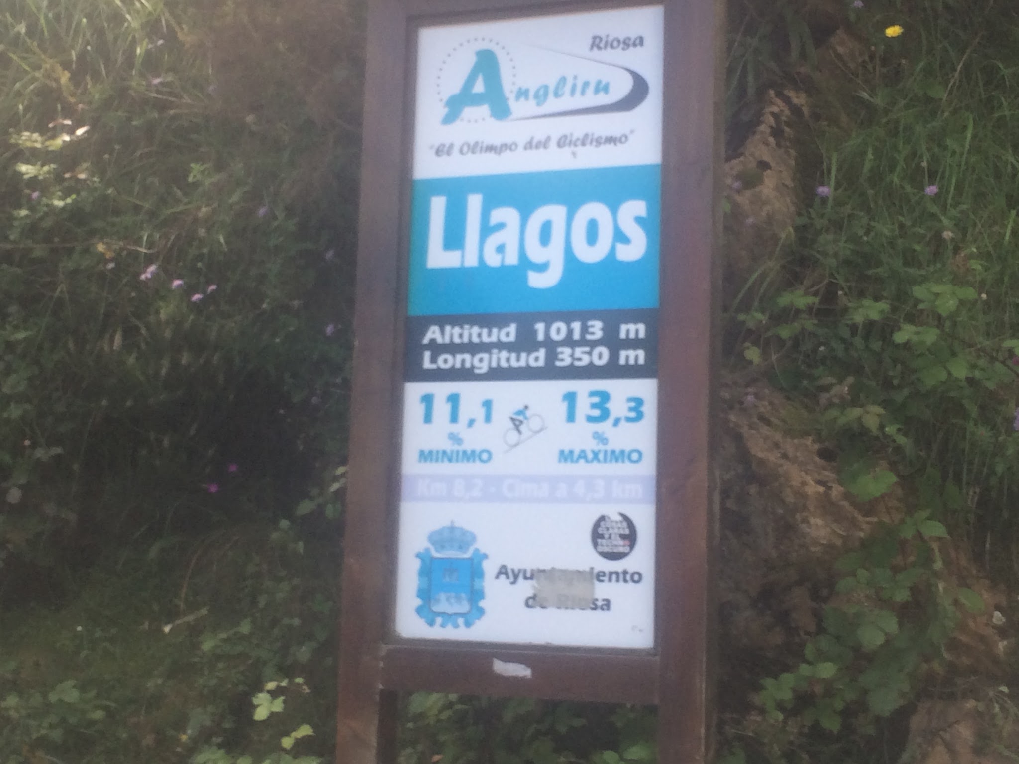 Cycling Alto de l'Angliru, Spain - mile marker for Angliru shows an altitude of 1013 meters