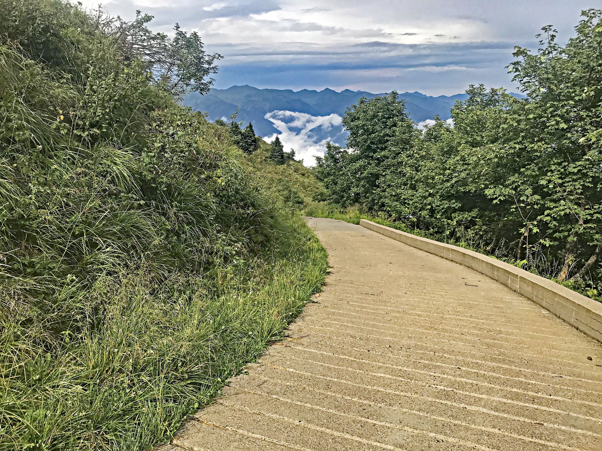 Climbing Passo della Forcella by bike - cement roadway at end.