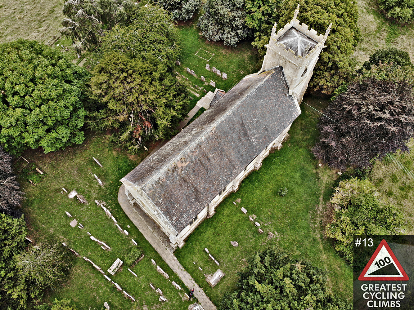 Cycling Dovers Hill - aerial view of Saint Lawrence's Church, Simon Warren's 100 Greatest Cycling Climbs #13 logo in corner